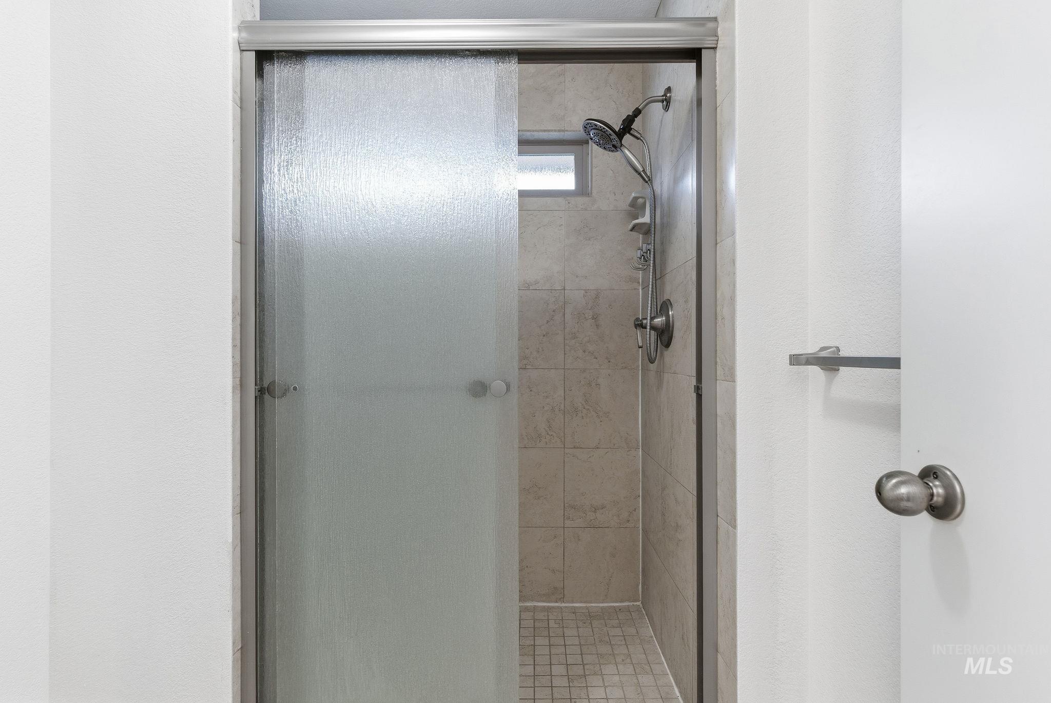 Full bath featuring a stall shower