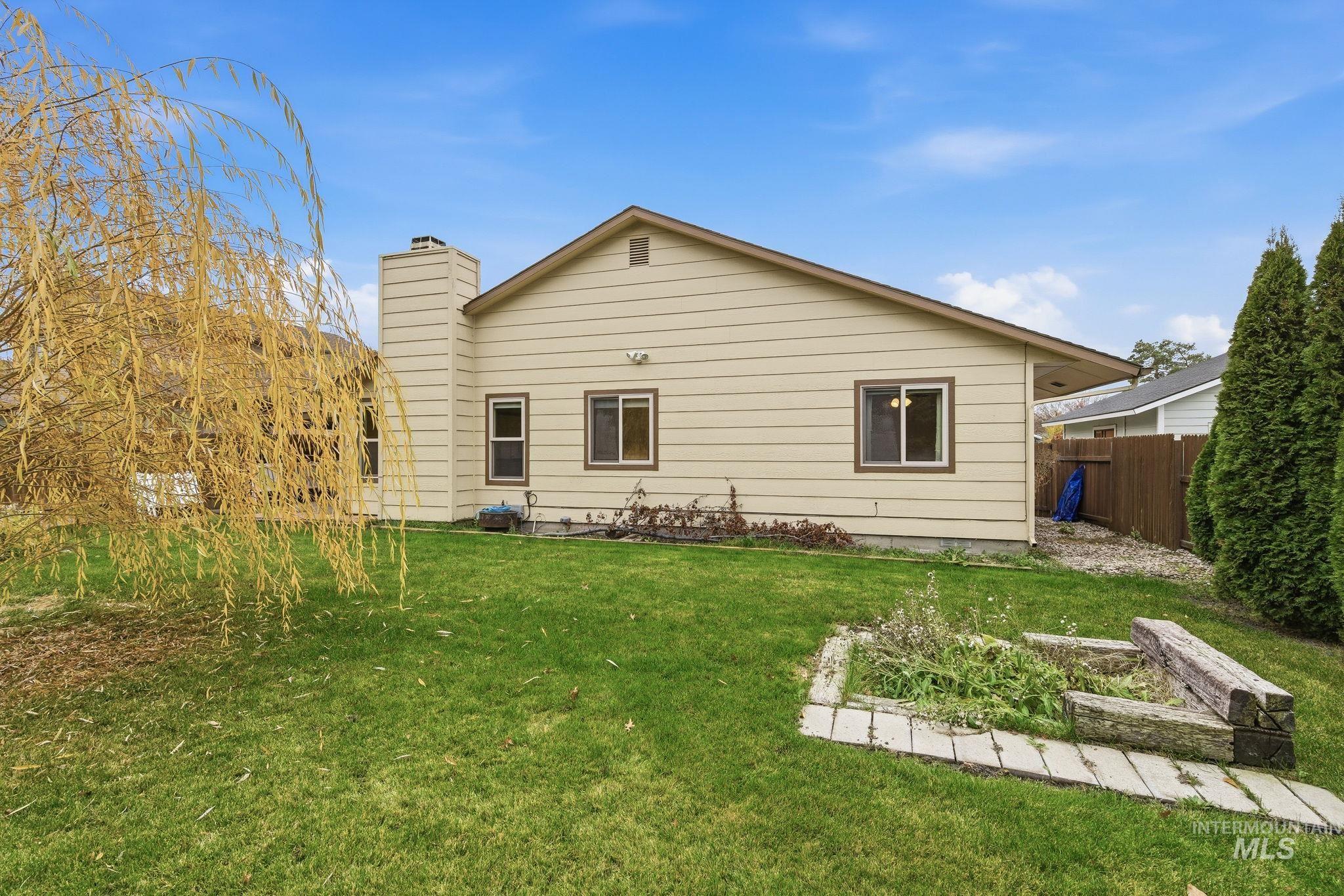 Back of house with a chimney