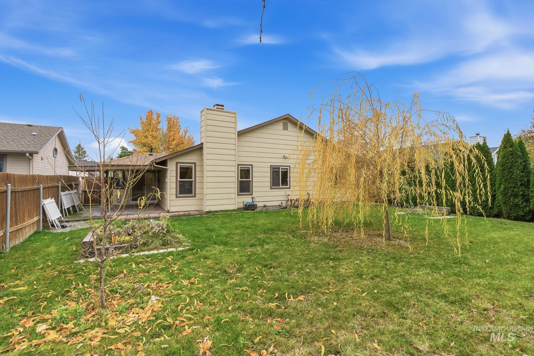 Back of property featuring a chimney