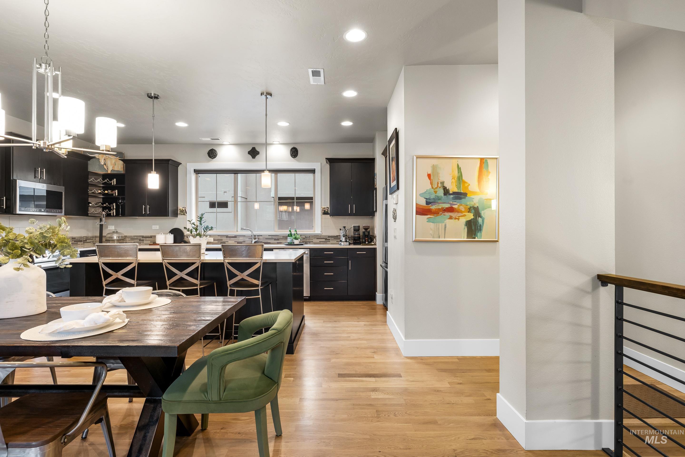 Dining area featuring recessed lighting and light wood-style floors