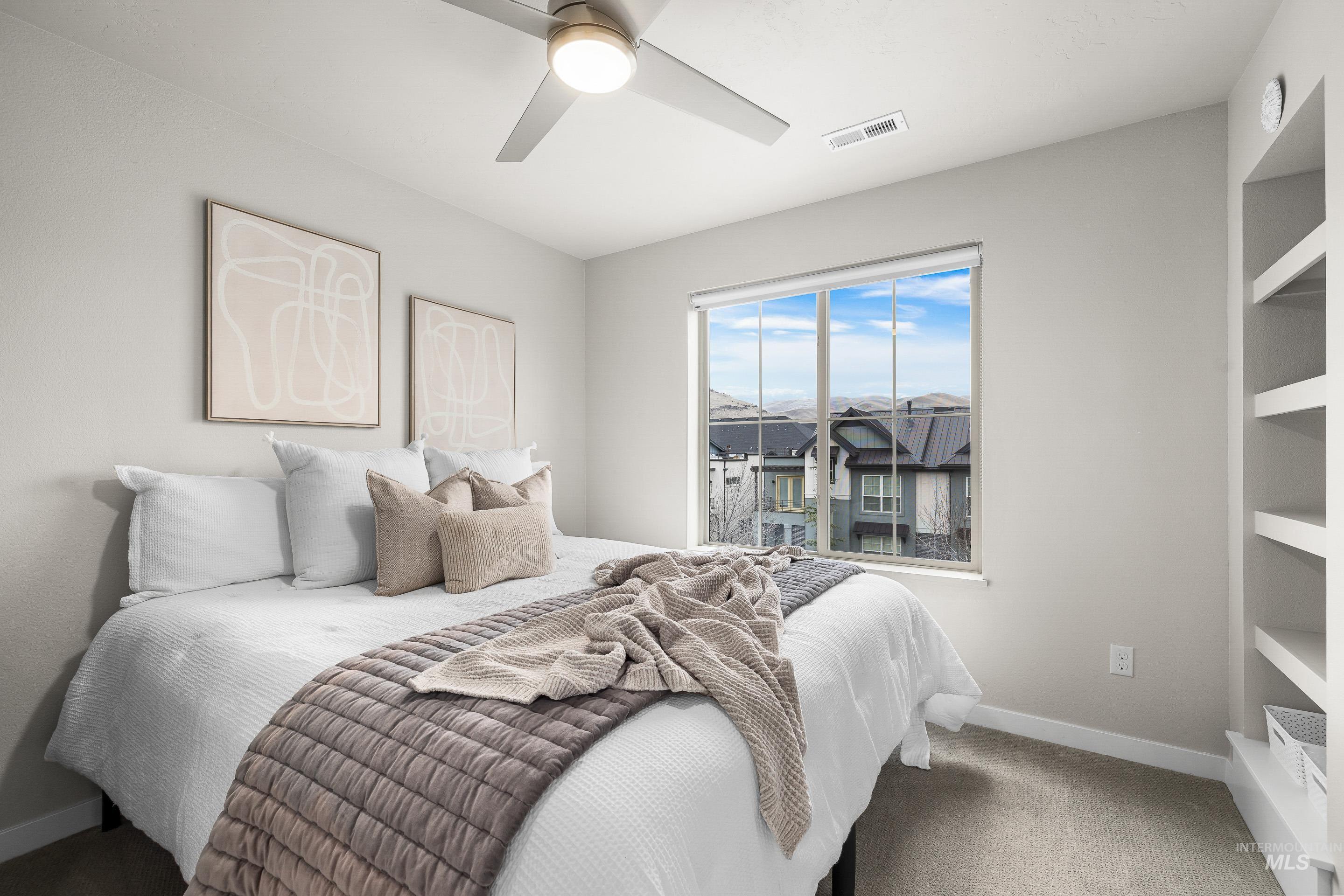 Bedroom with baseboards and a ceiling fan