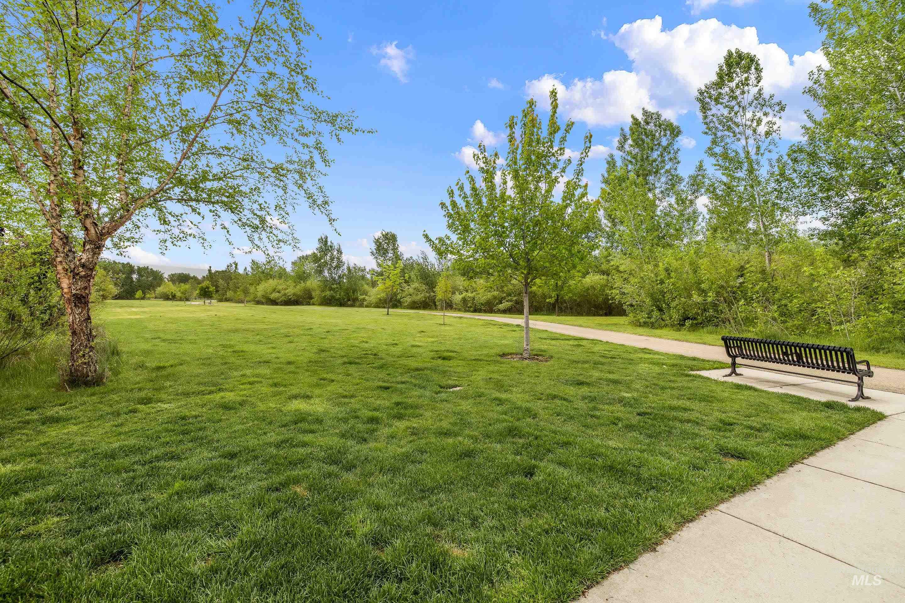 View of community featuring a yard