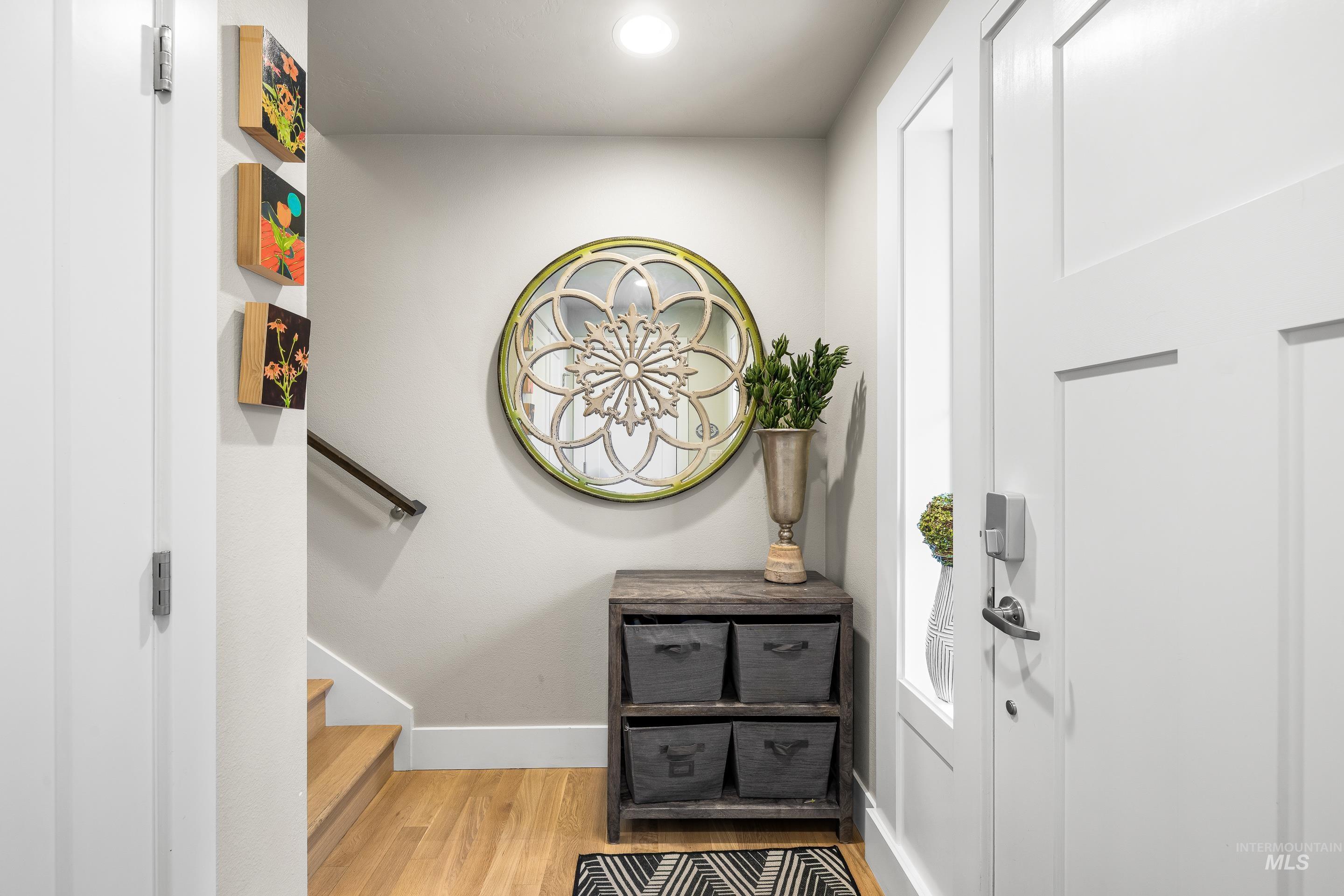 Entryway featuring stairway, wood finished floors, and recessed lighting