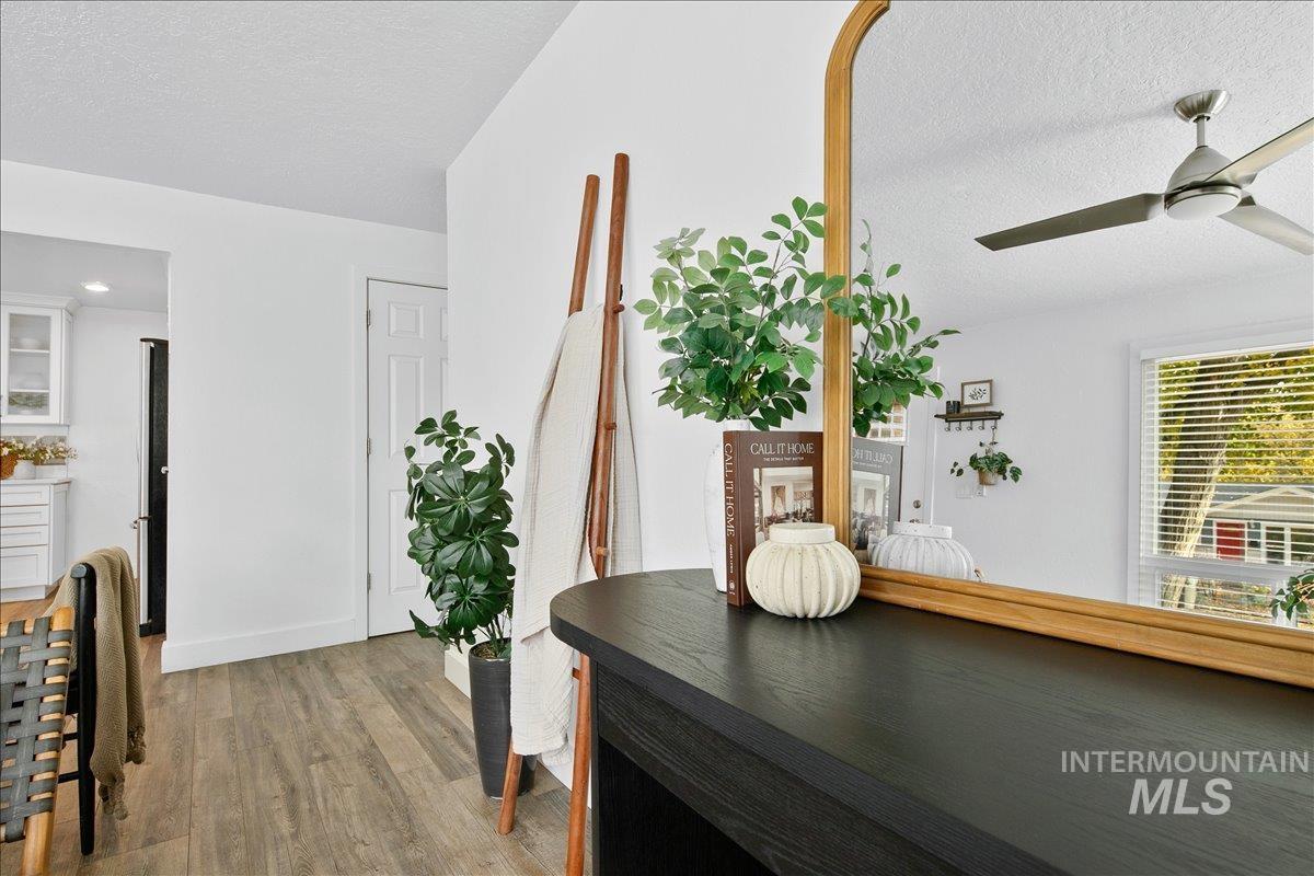 Interior space with a textured ceiling and light wood finished floors