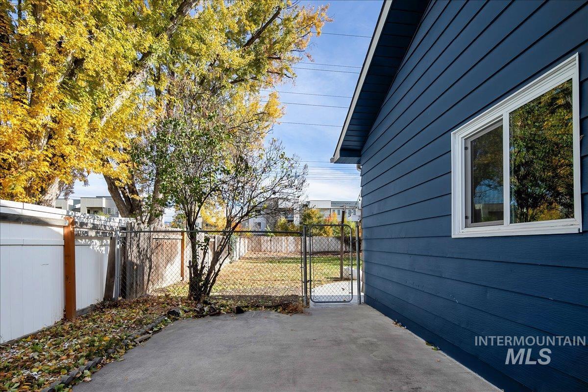 View of patio with a gate
