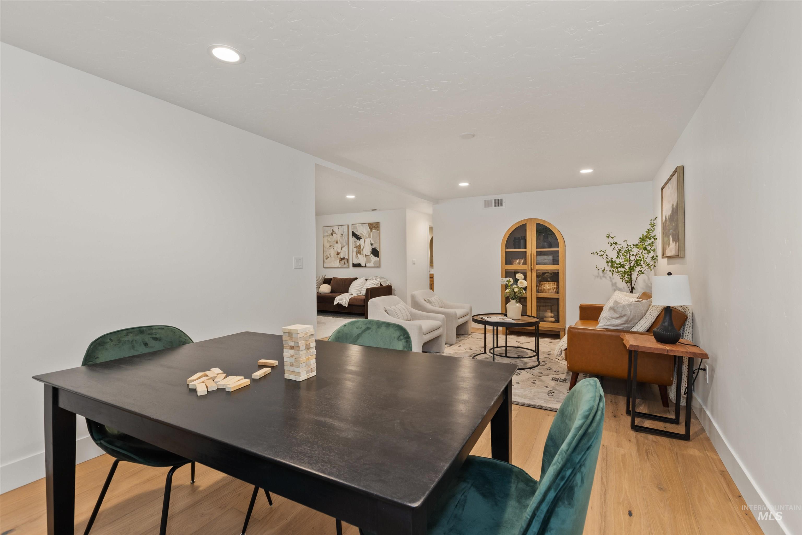 Dining area featuring recessed lighting and light wood-style flooring