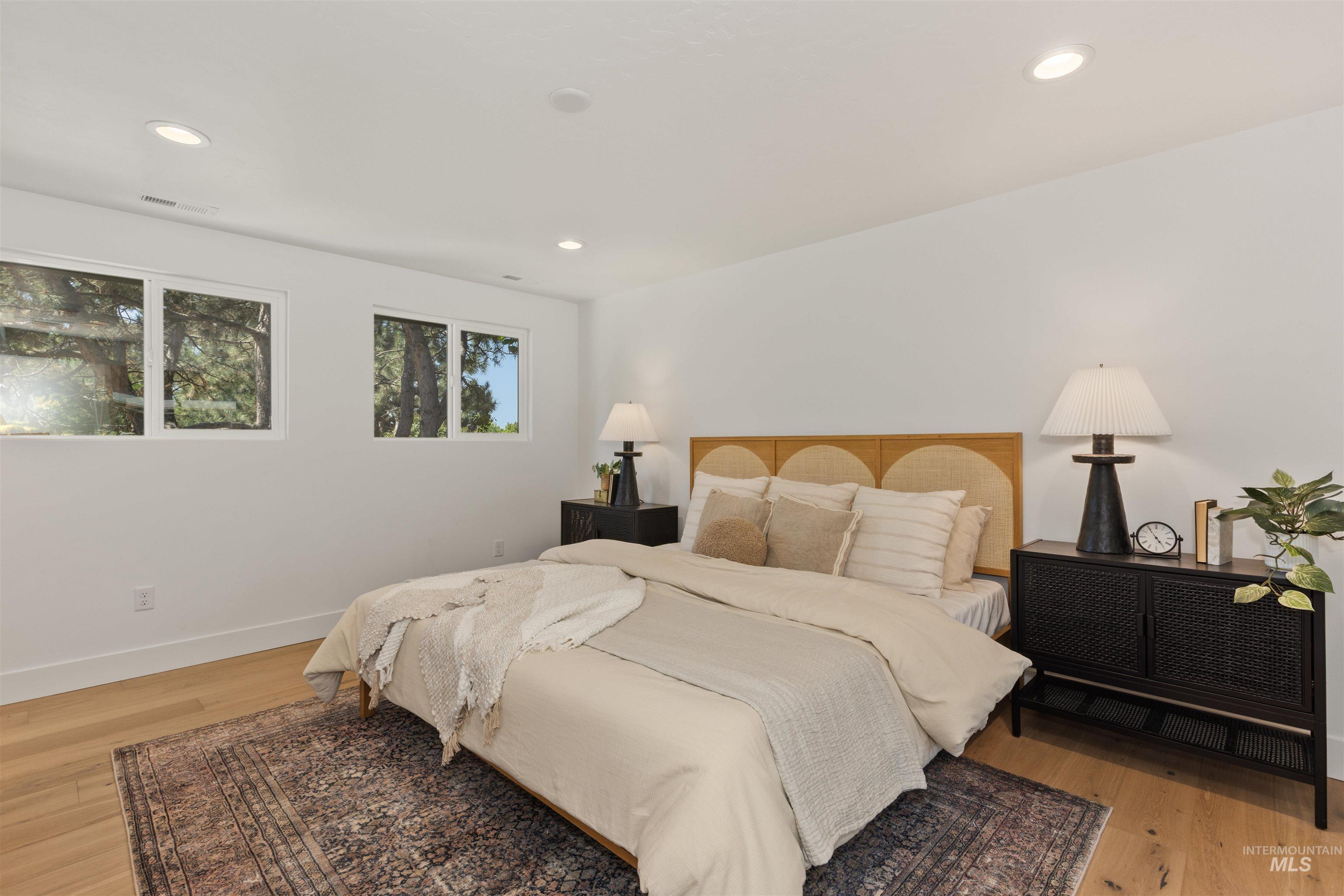 Bedroom featuring light wood finished floors and recessed lighting