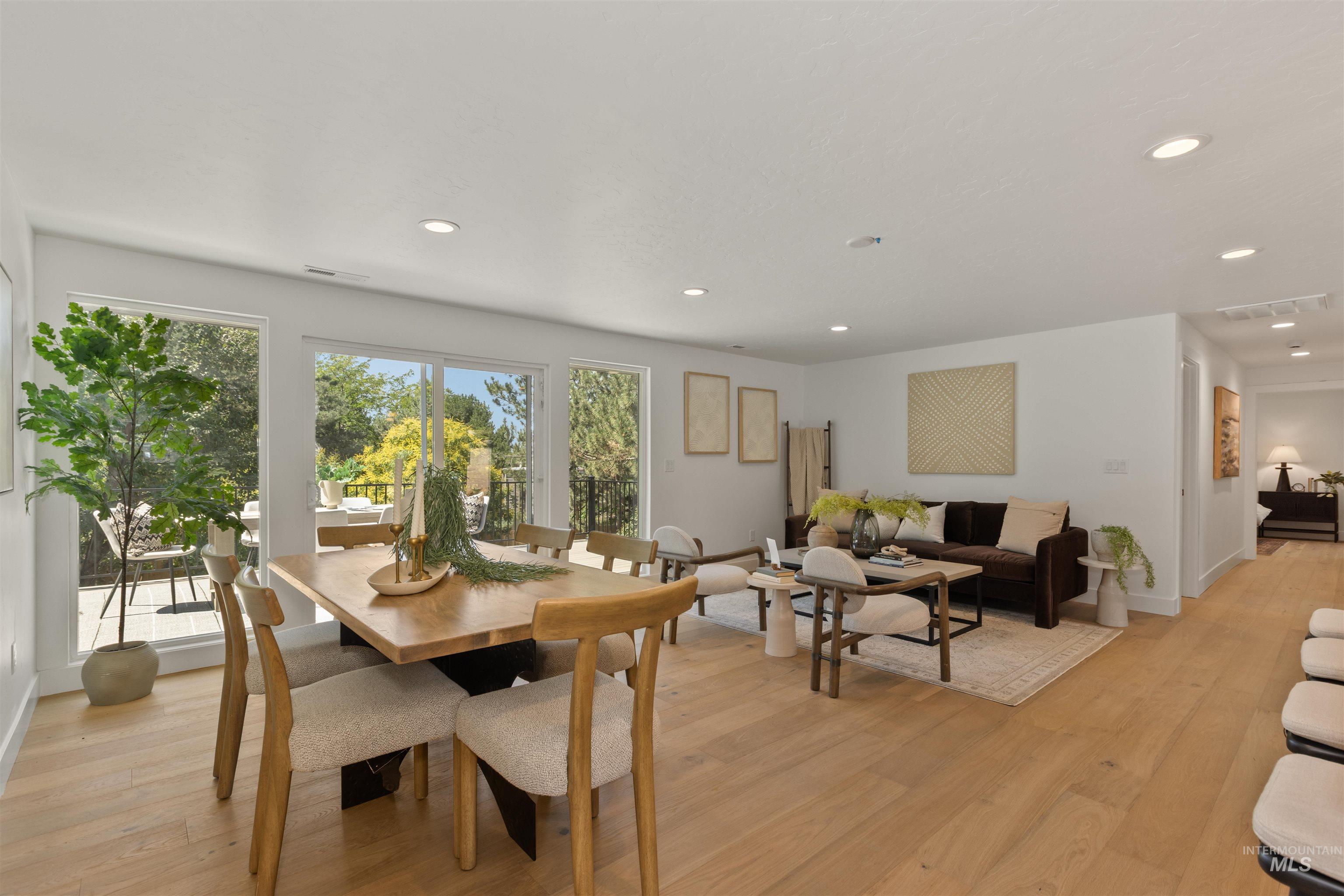 Dining room featuring light wood-type flooring and recessed lighting