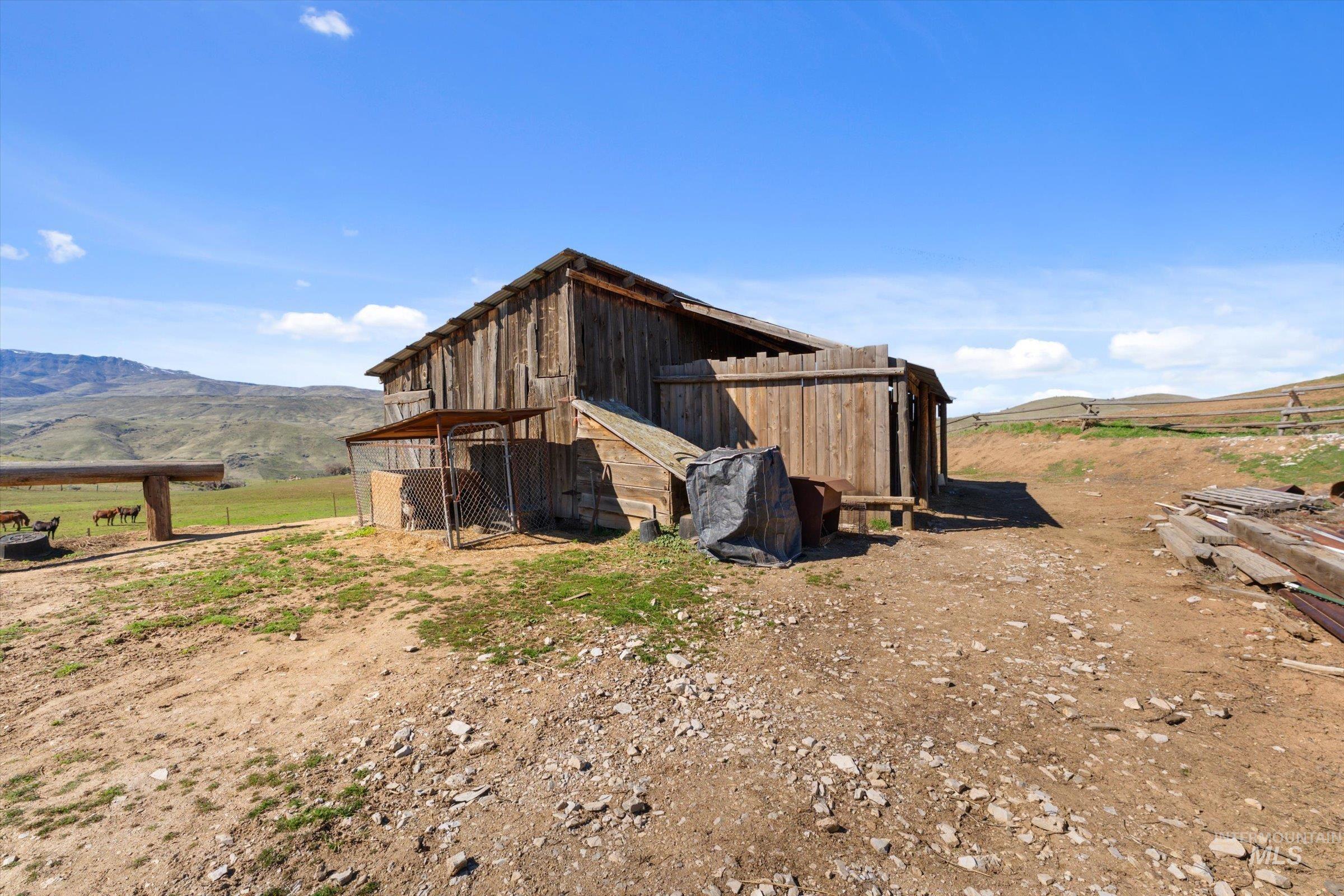 View of outdoor structure with a mountain view and a view of rural / pastoral area