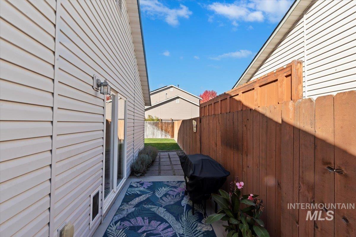View of property exterior featuring a patio