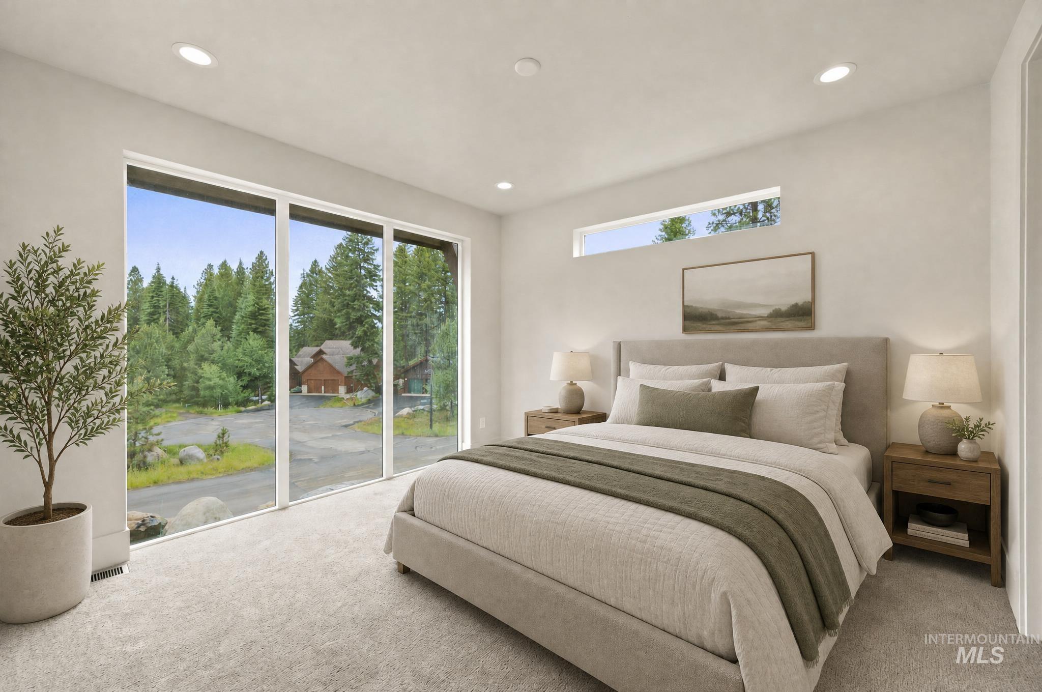 Interior space featuring expansive floor-to-ceiling windows, recessed lighting, a horizontal clerestory window, wall-to-wall carpeting, and a neutral color palette - Ensuite Second Floor