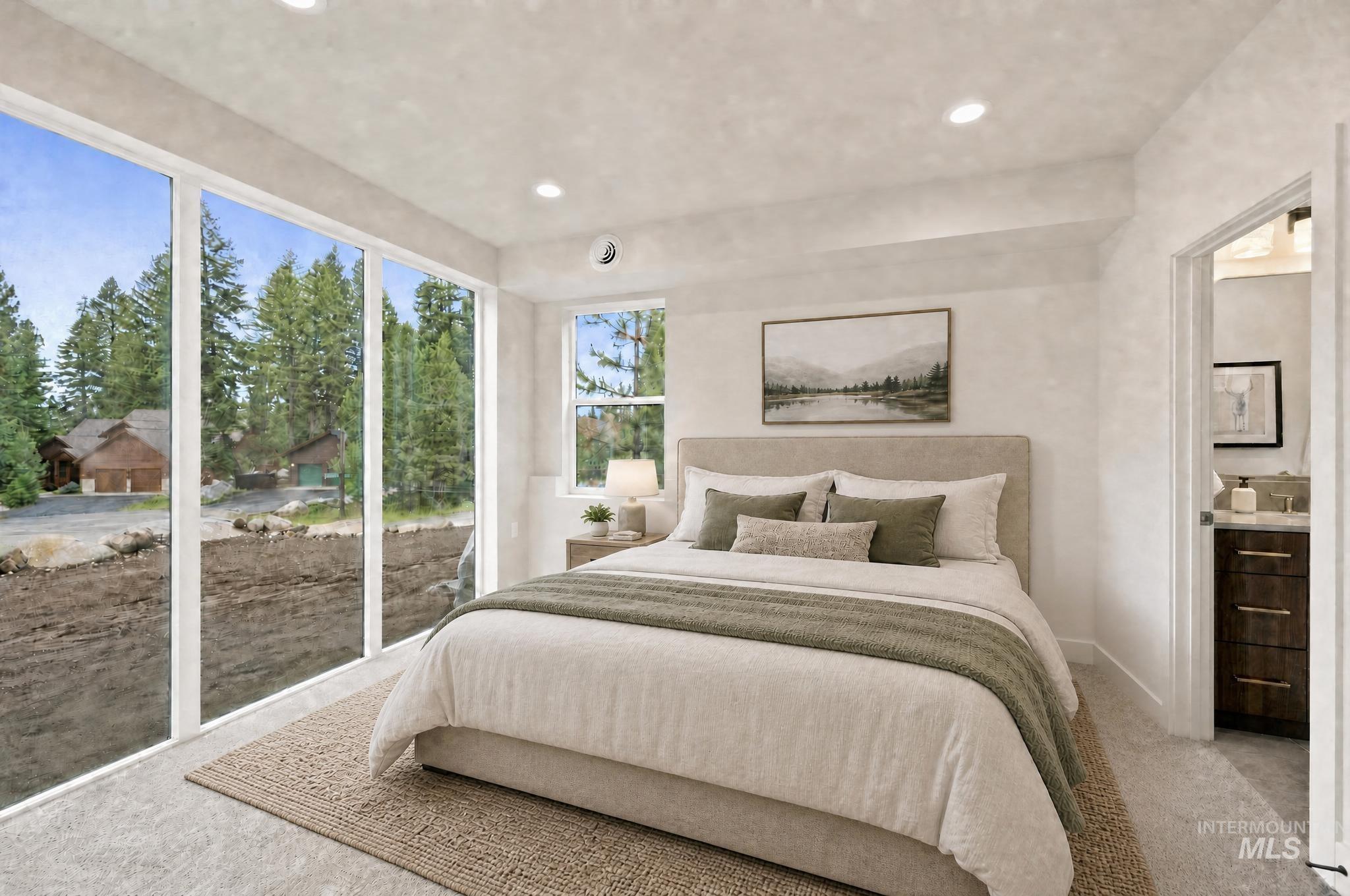 Room featuring expansive floor-to-ceiling windows, recessed lighting, and soft carpet flooring