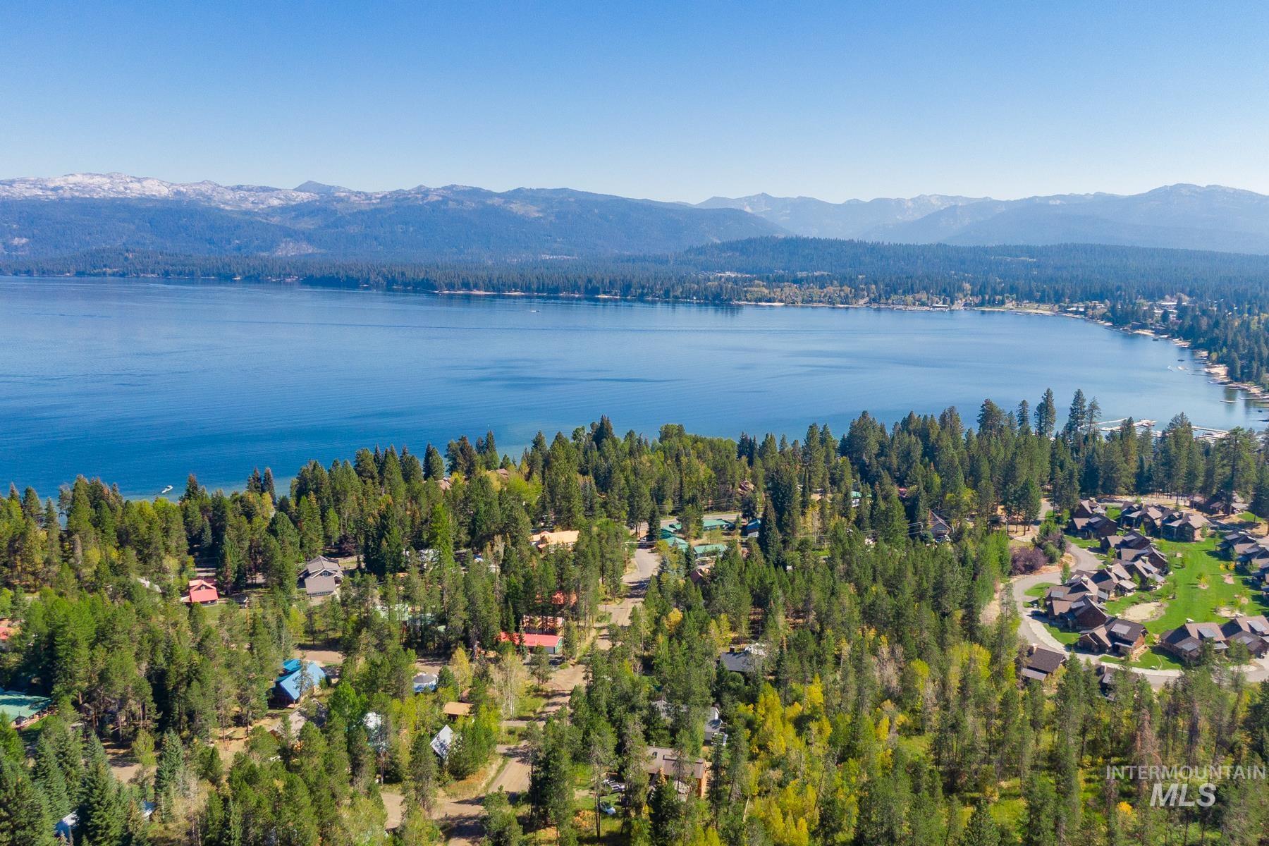 Aerial perspective of suburban area featuring a water and mountain view