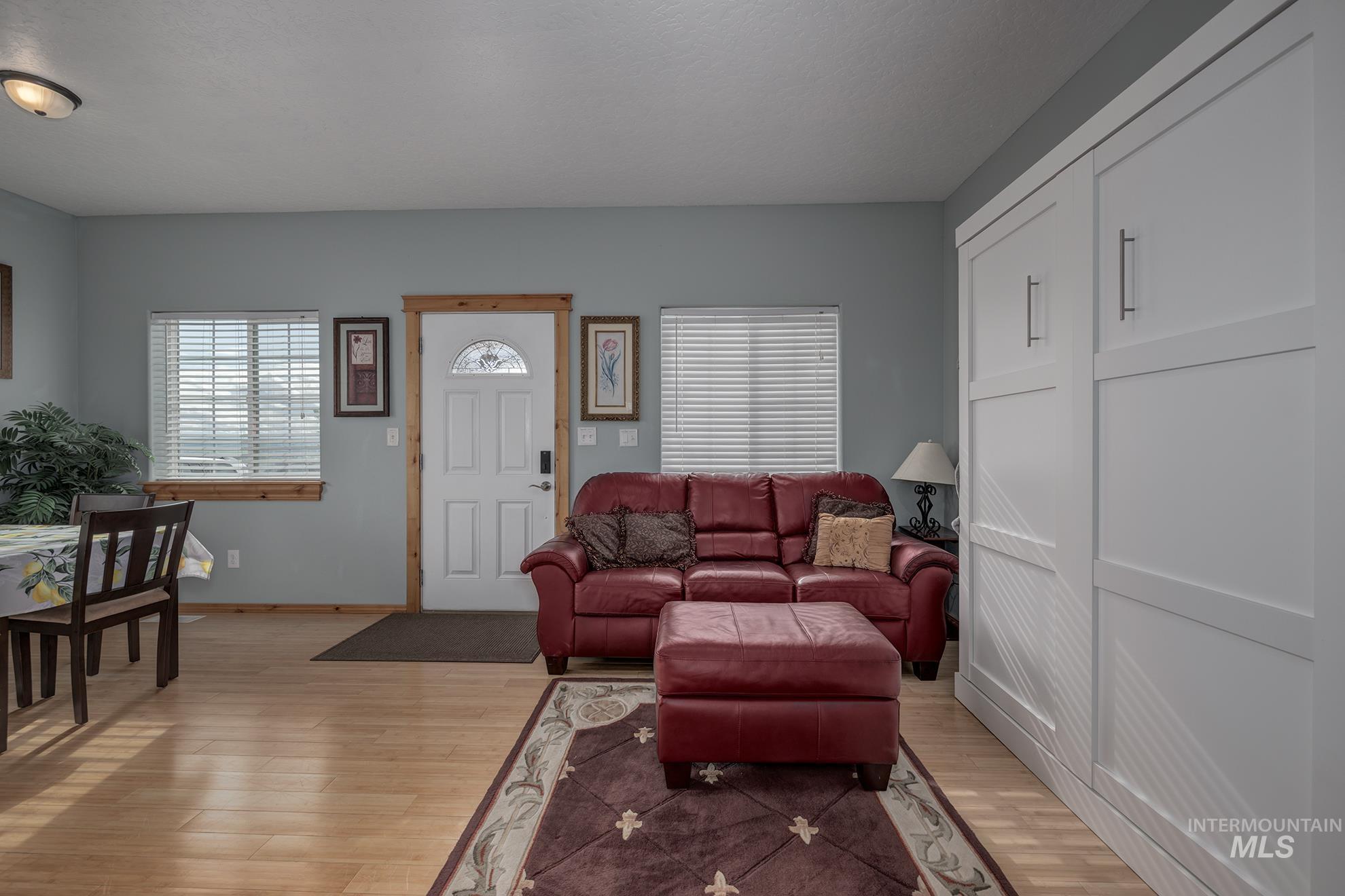 Guest house living area with light wood-style flooring