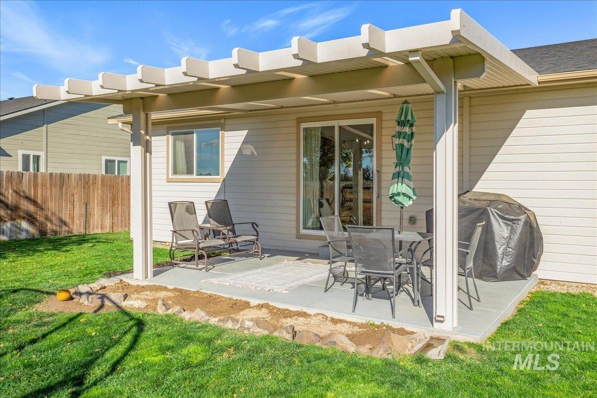 Back of property featuring a patio area