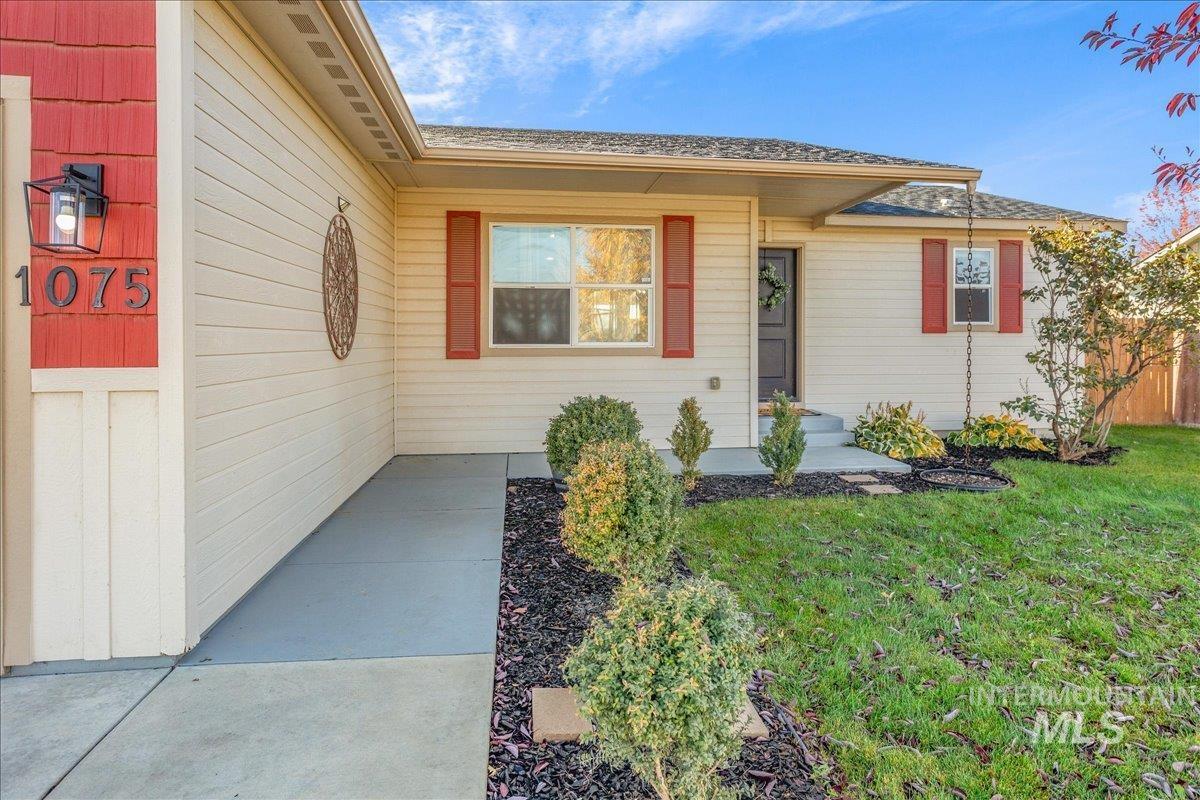 Property entrance with roof with shingles