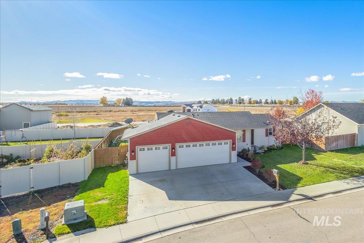 Ranch-style home with an attached garage and concrete driveway