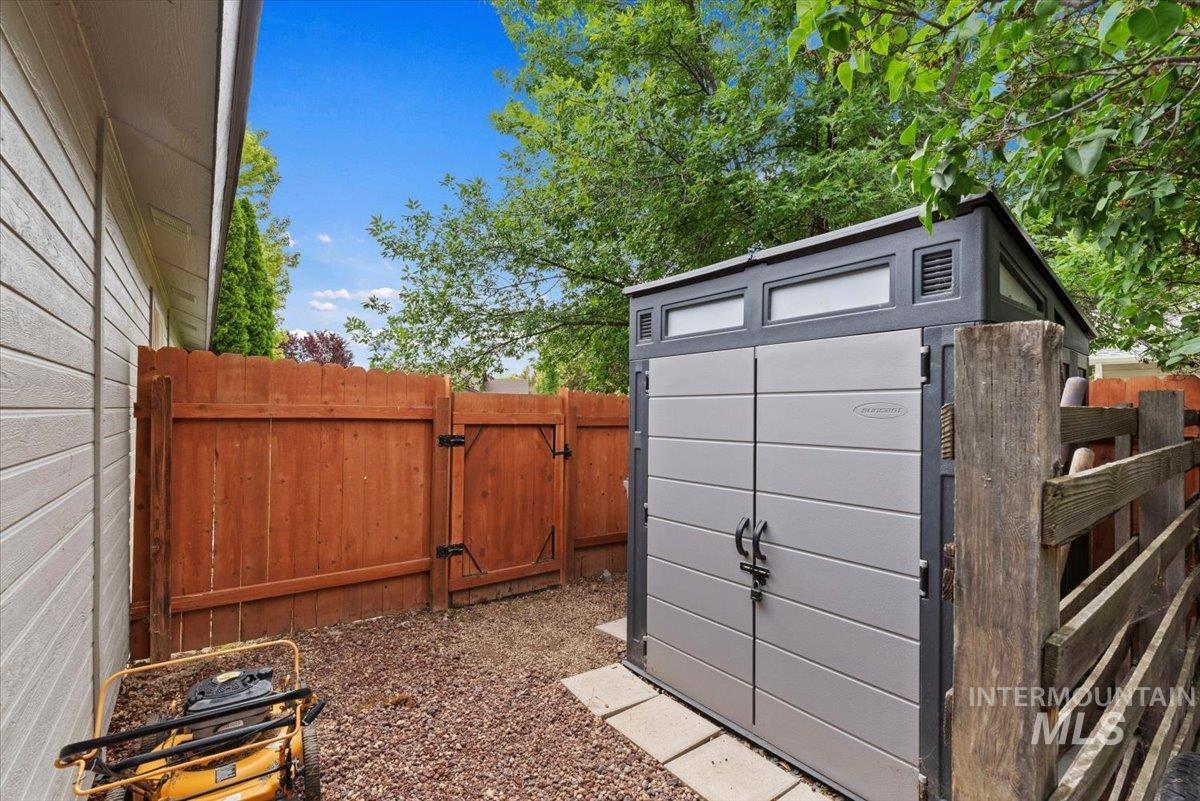 Exterior storage shed with double doors, transom windows, and integrated ventilation