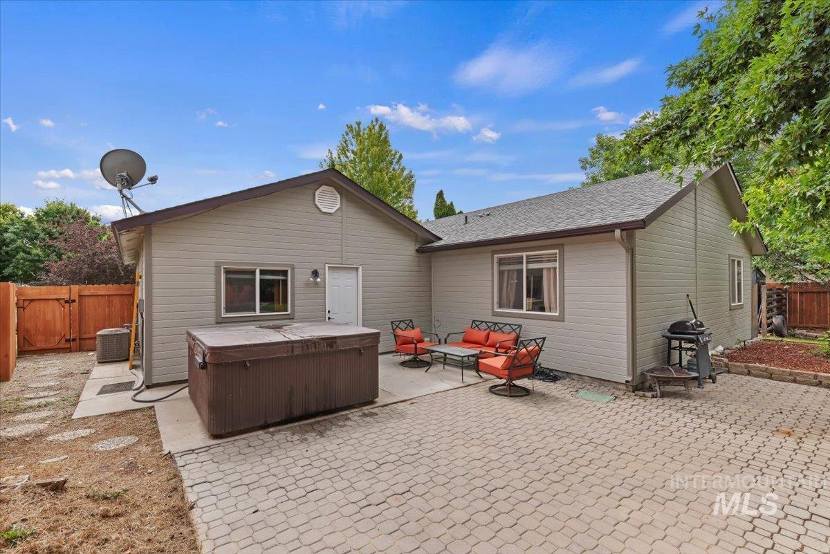Spacious outdoor patio with paver stone flooring