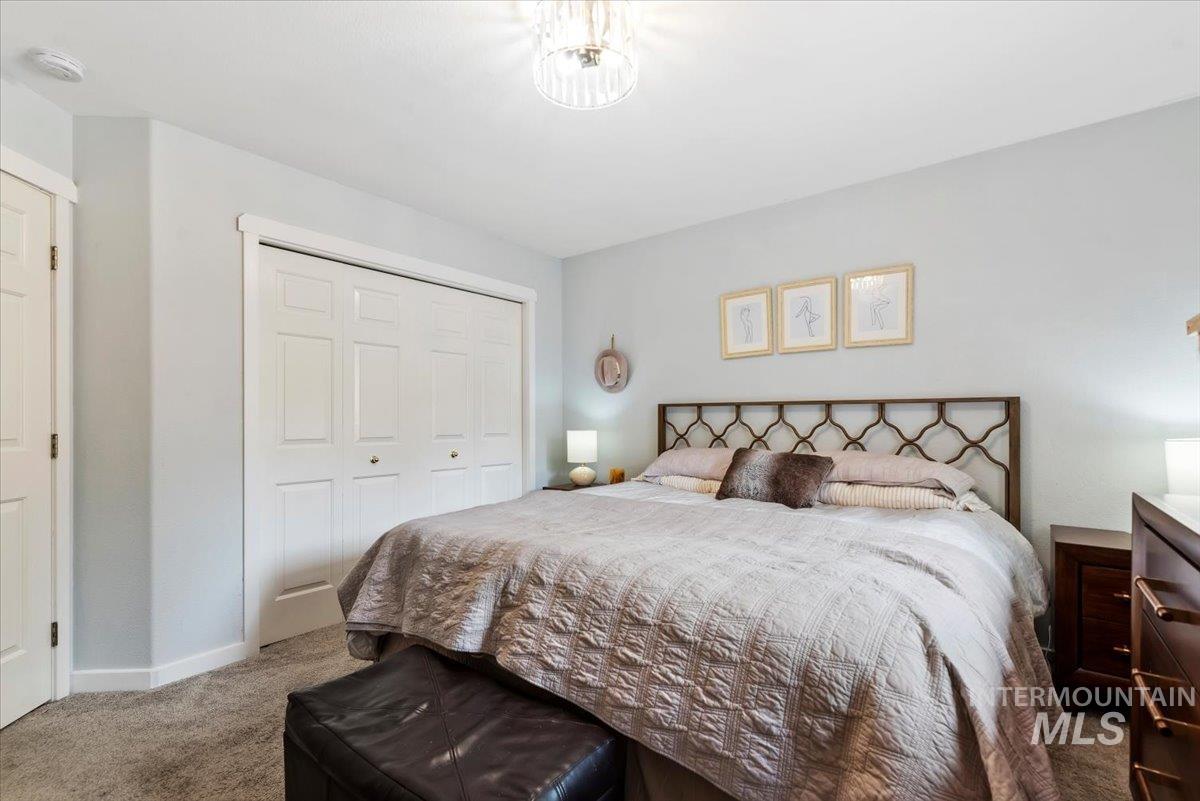 Carpeted interior space featuring light-colored walls and white trim