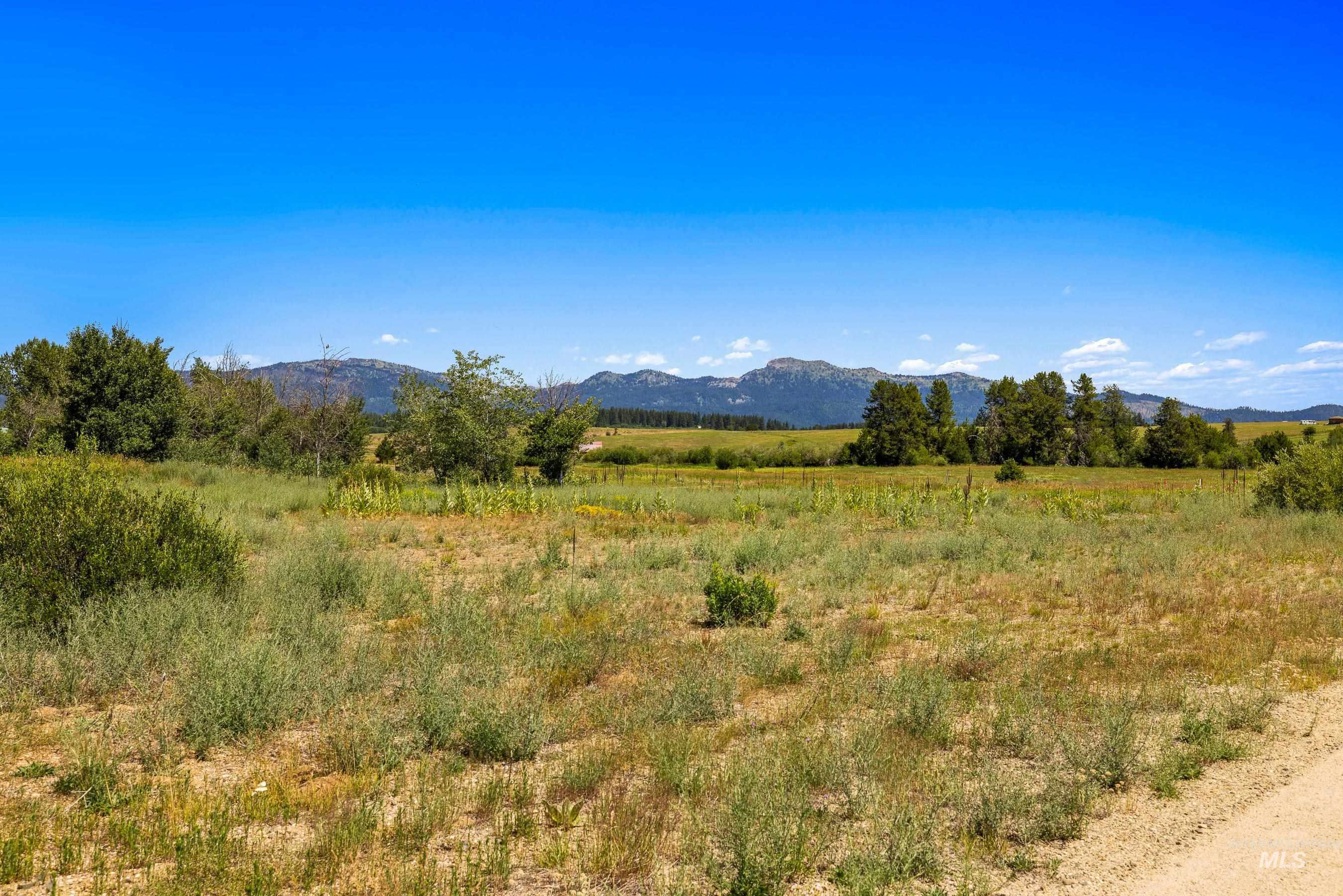 View of mountain backdrop featuring rural landscape