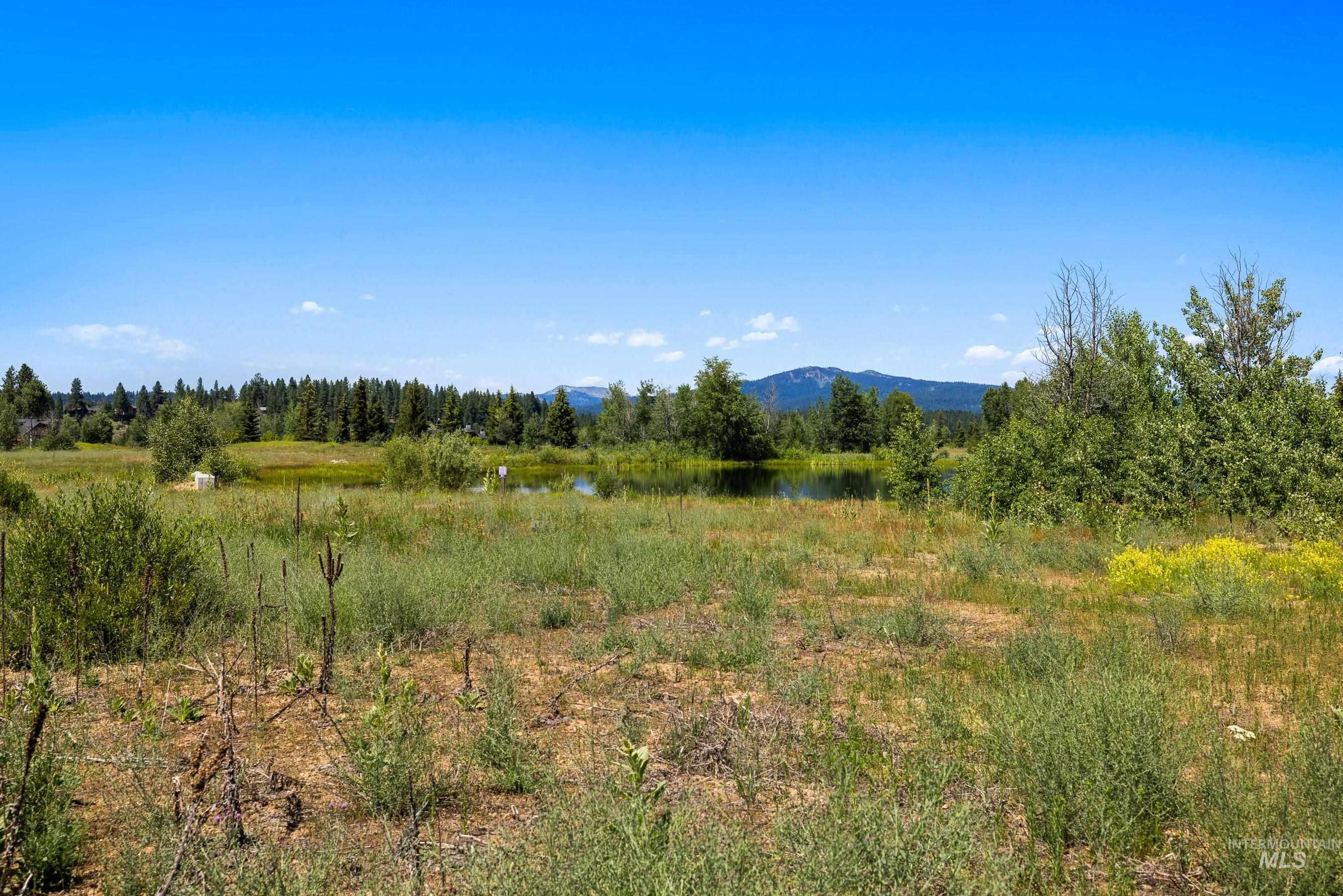 View of mountain backdrop with a nearby body of water