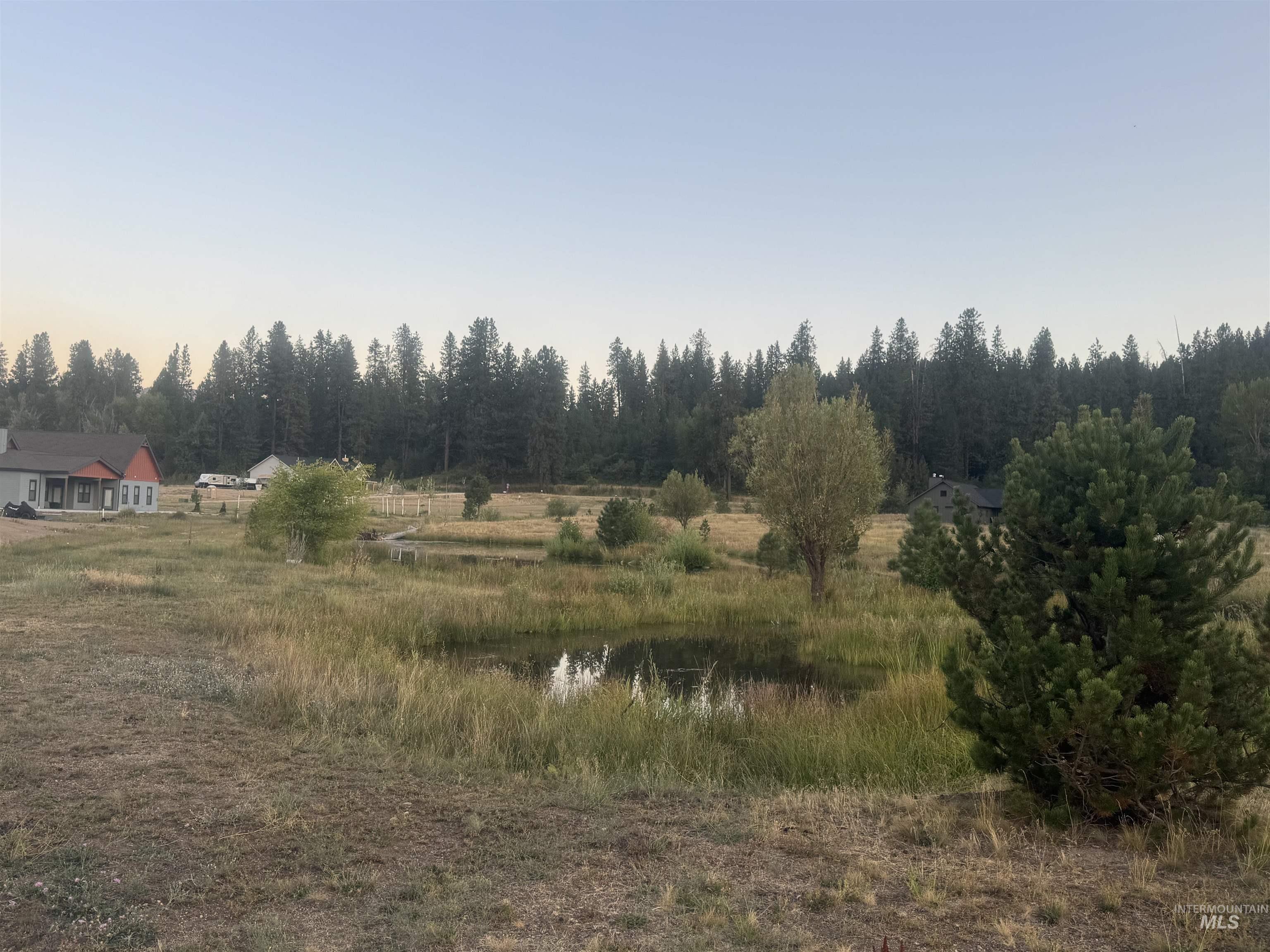 View of woods featuring a water view