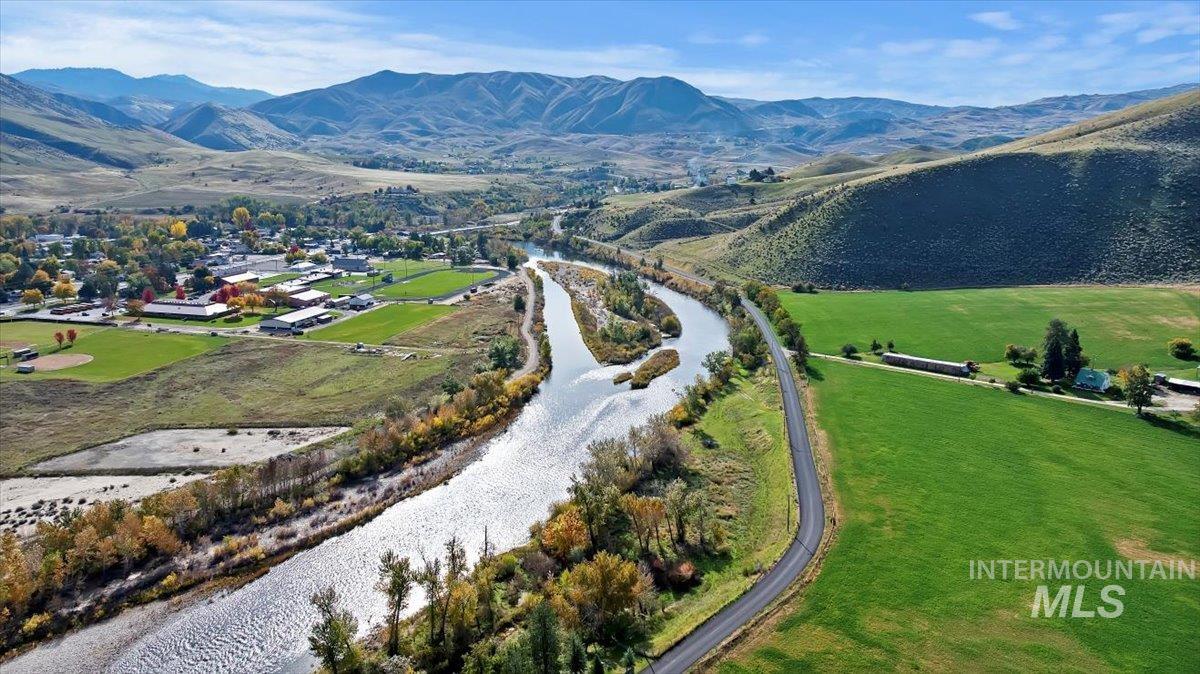 View of property location with rural landscape and a water and mountain view