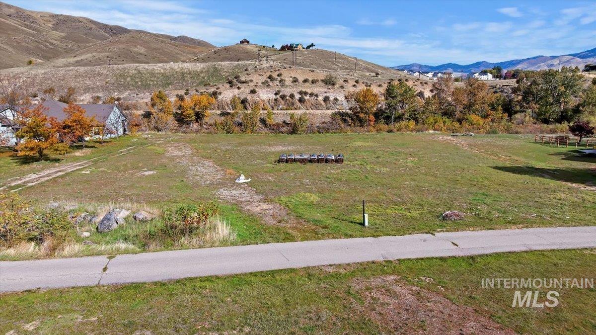 View of mountain backdrop featuring rural landscape