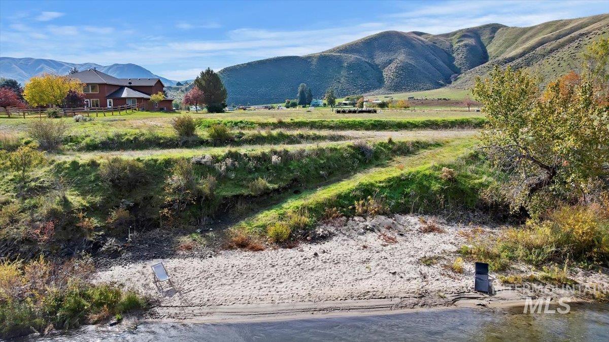 View of mountain backdrop with rural landscape