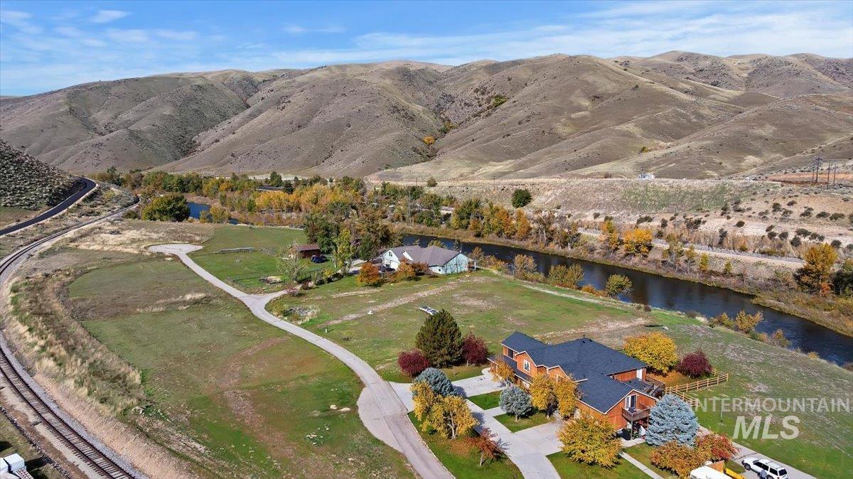 Aerial view of property and surrounding area featuring rural landscape