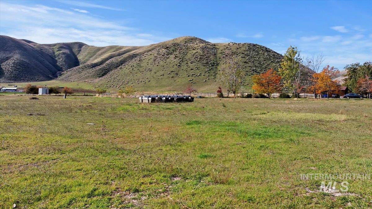 View of mountain background featuring rural landscape