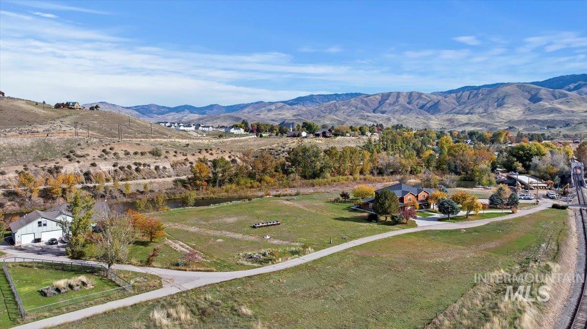 Aerial view of sparsely populated area with a mountainous background