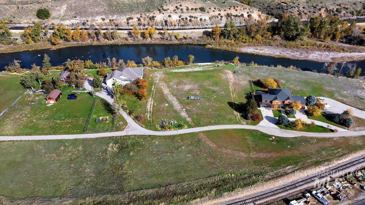 Aerial overview of property's location with a nearby body of water