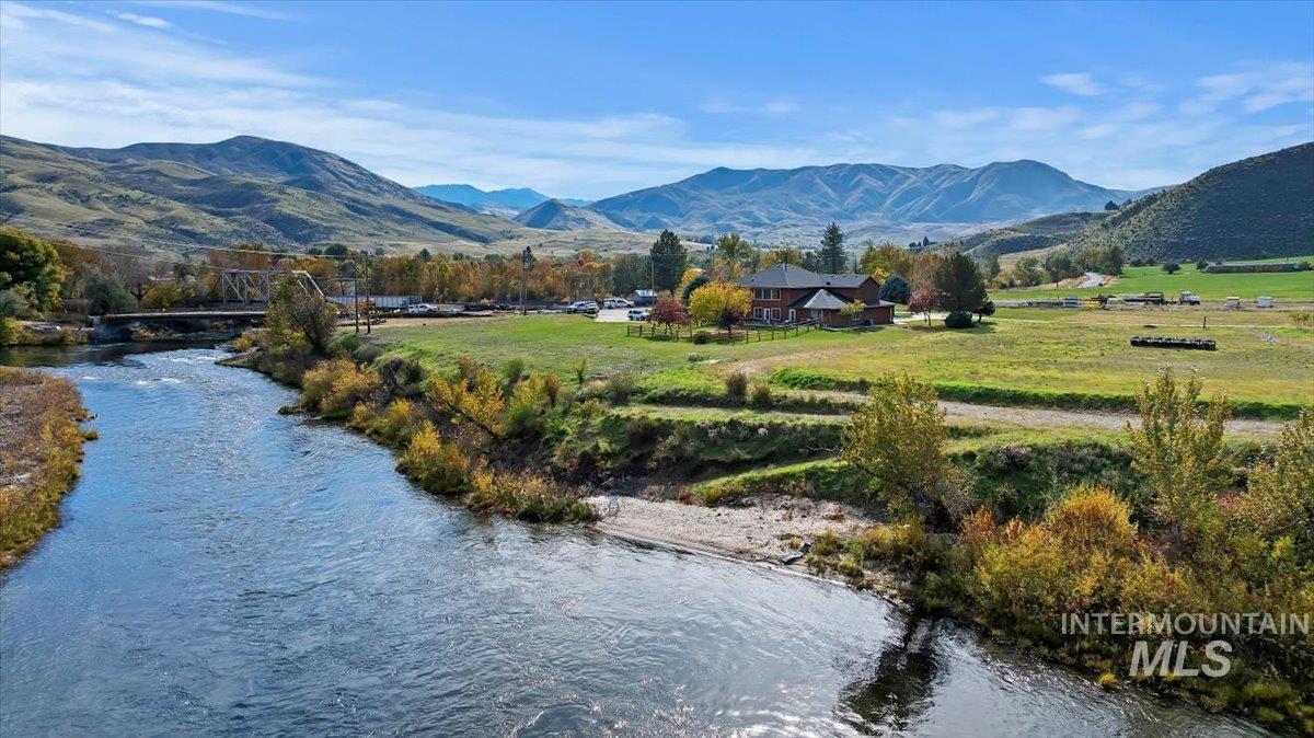 Mountain view featuring a nearby body of water and rural landscape
