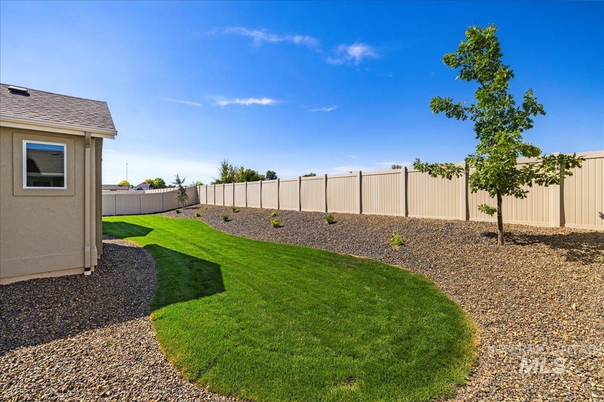 View of fenced backyard