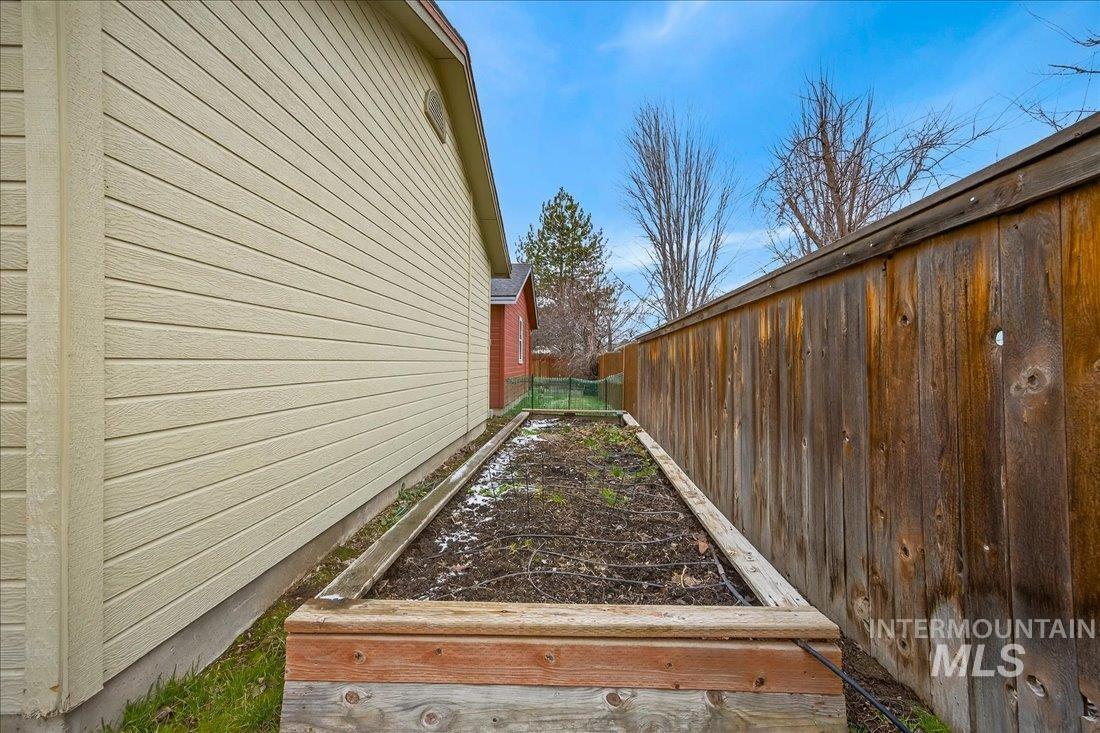 View of home's exterior with a vegetable garden