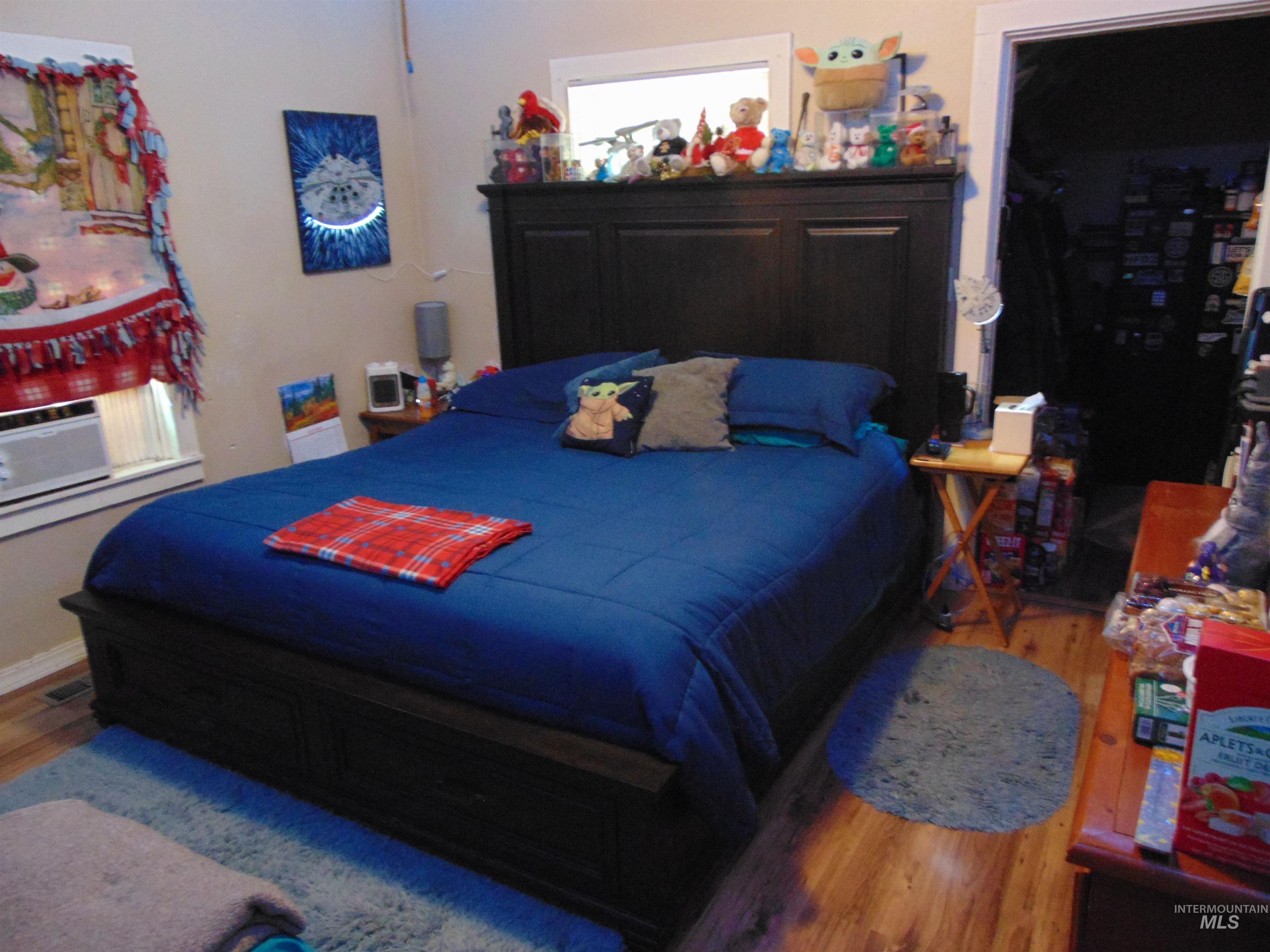 Bedroom with wood finished floors