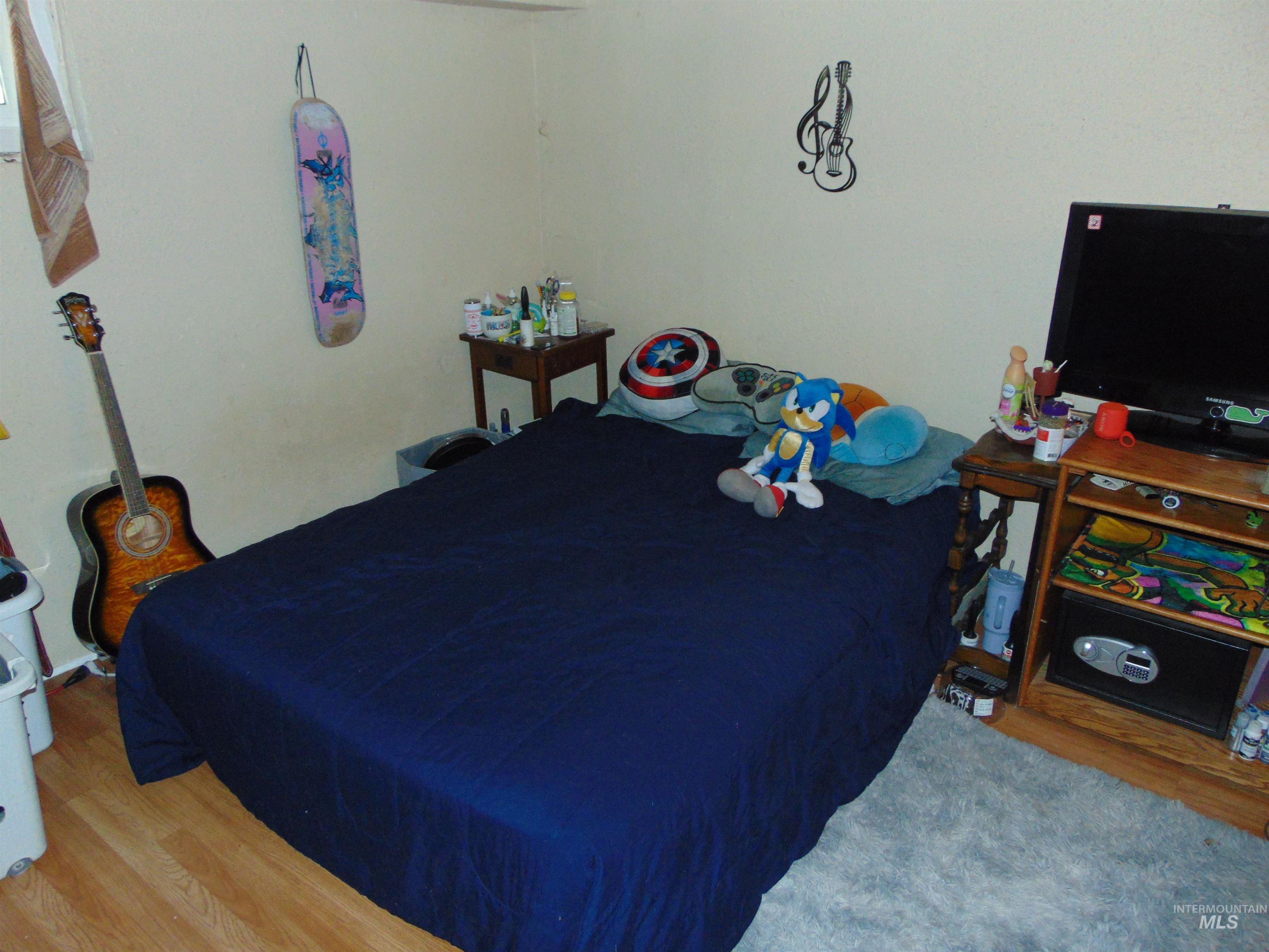 Bedroom featuring wood finished floors