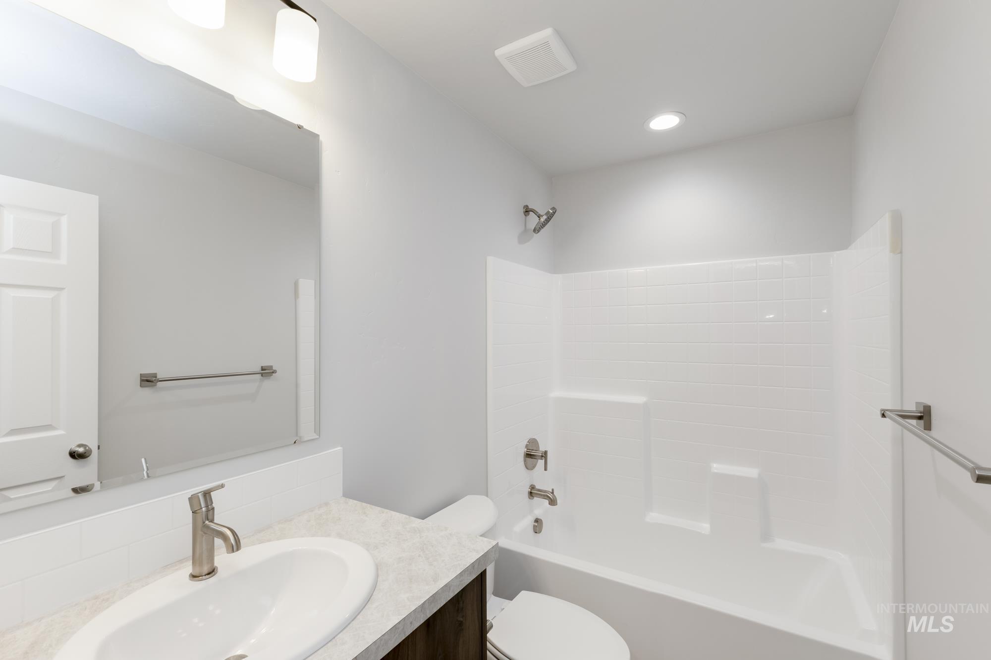 Bathroom featuring shower / bath combination and vanity