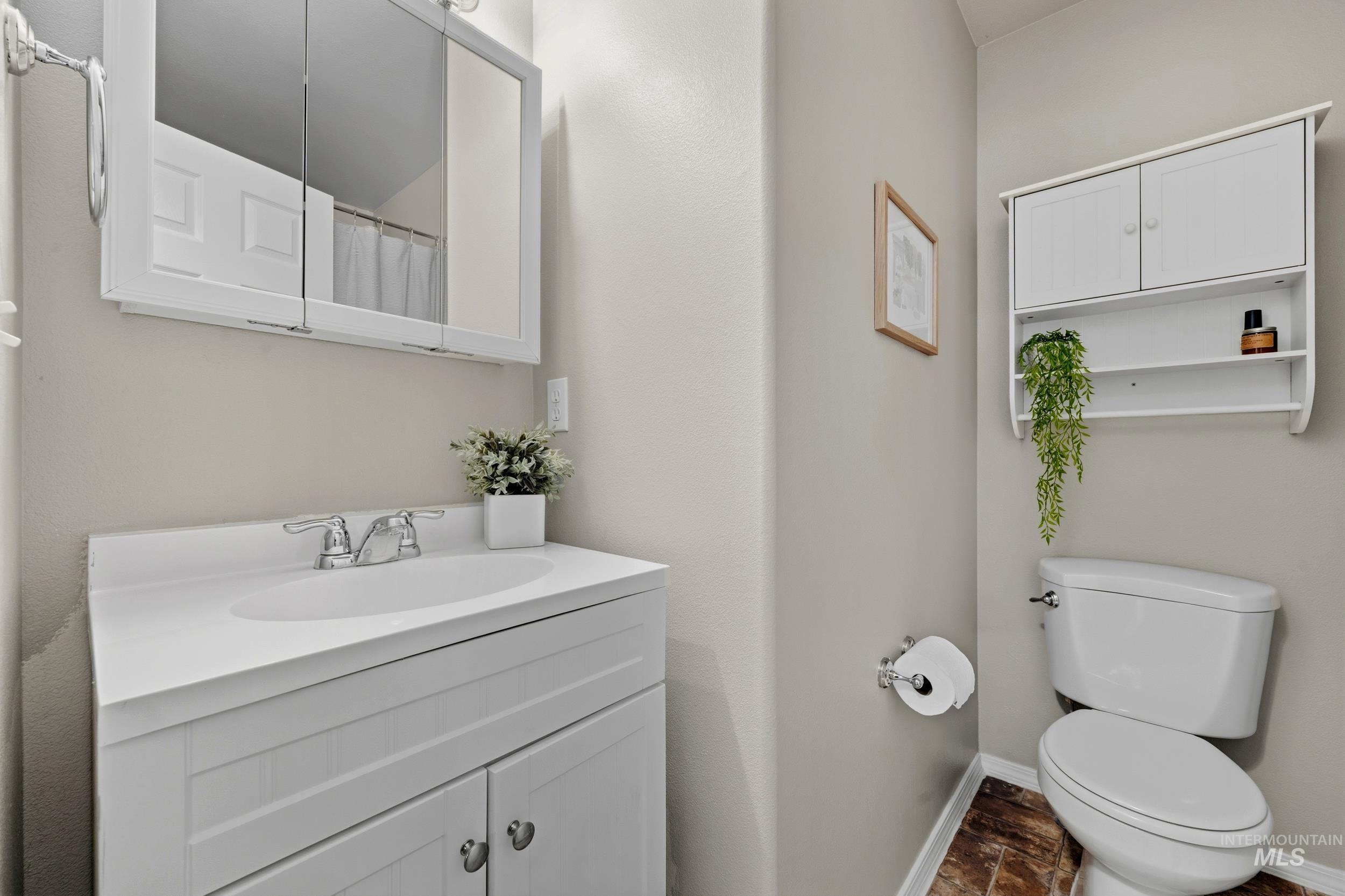 Full bathroom featuring vanity and a shower with shower curtain