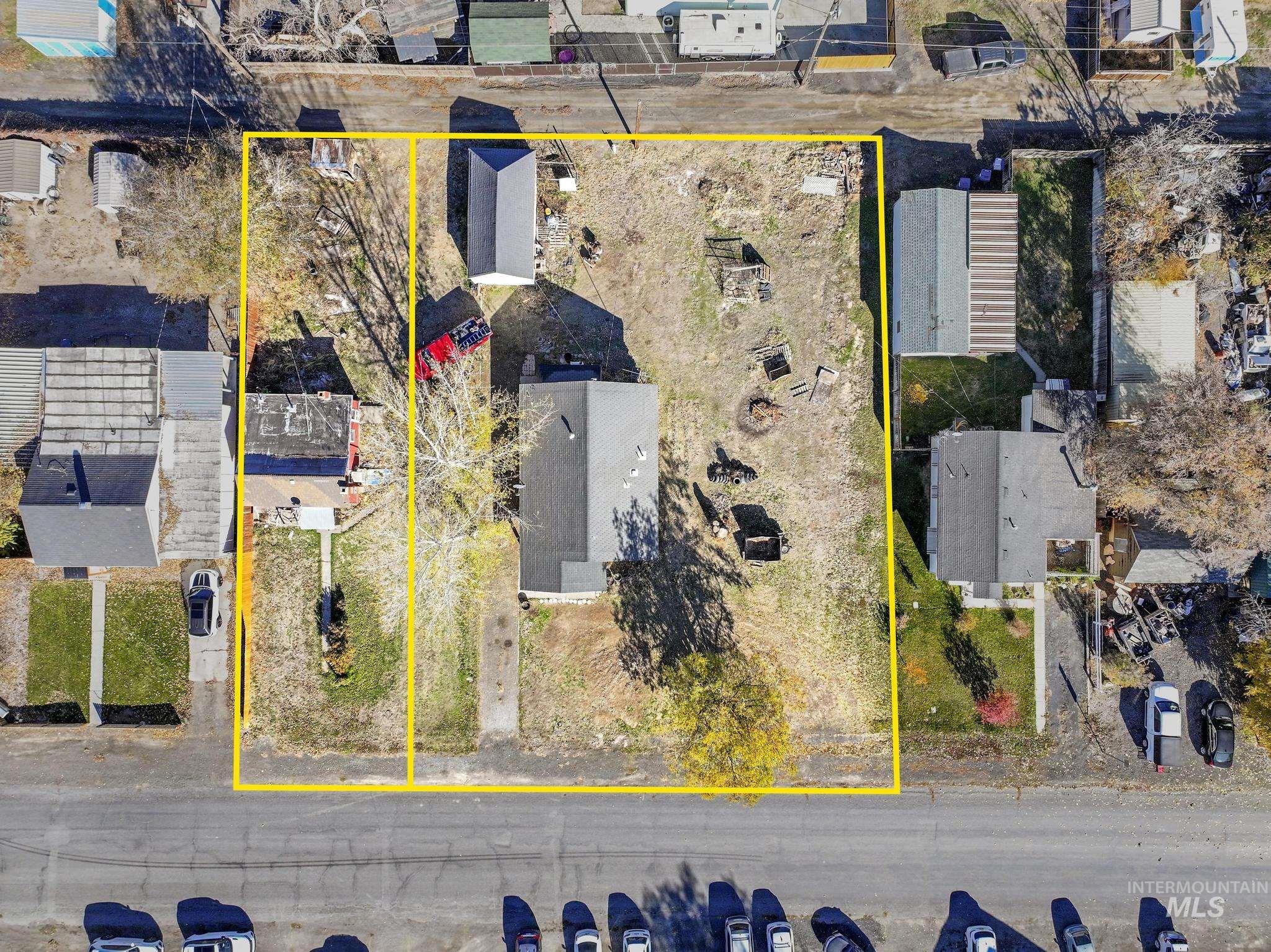 Aerial view of residential area with property parcel outlined