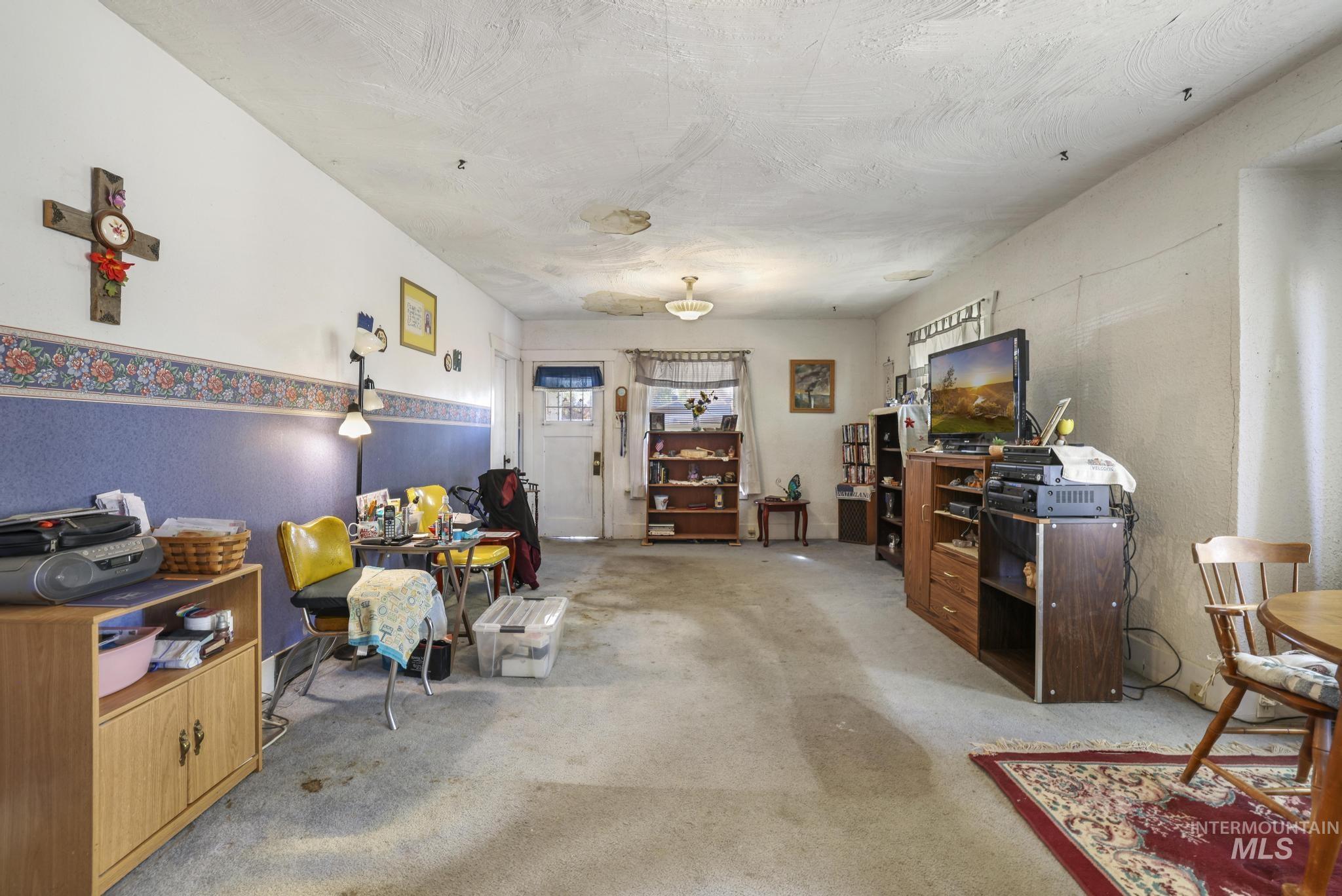 Living area featuring carpet floors and an office area