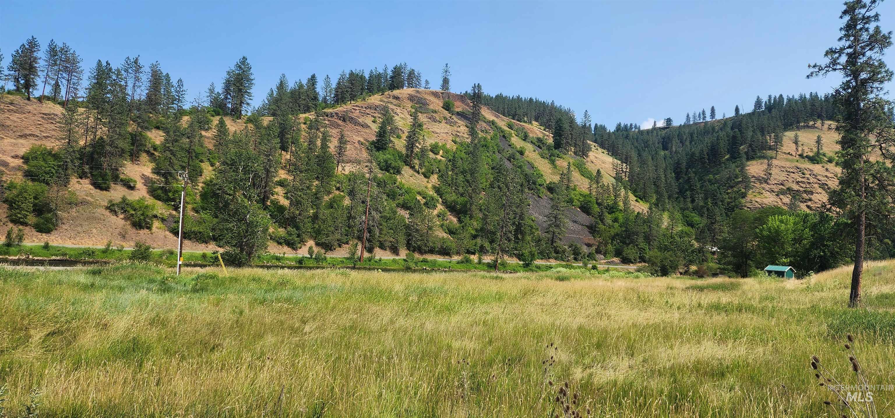 View of mountain backdrop with rural landscape