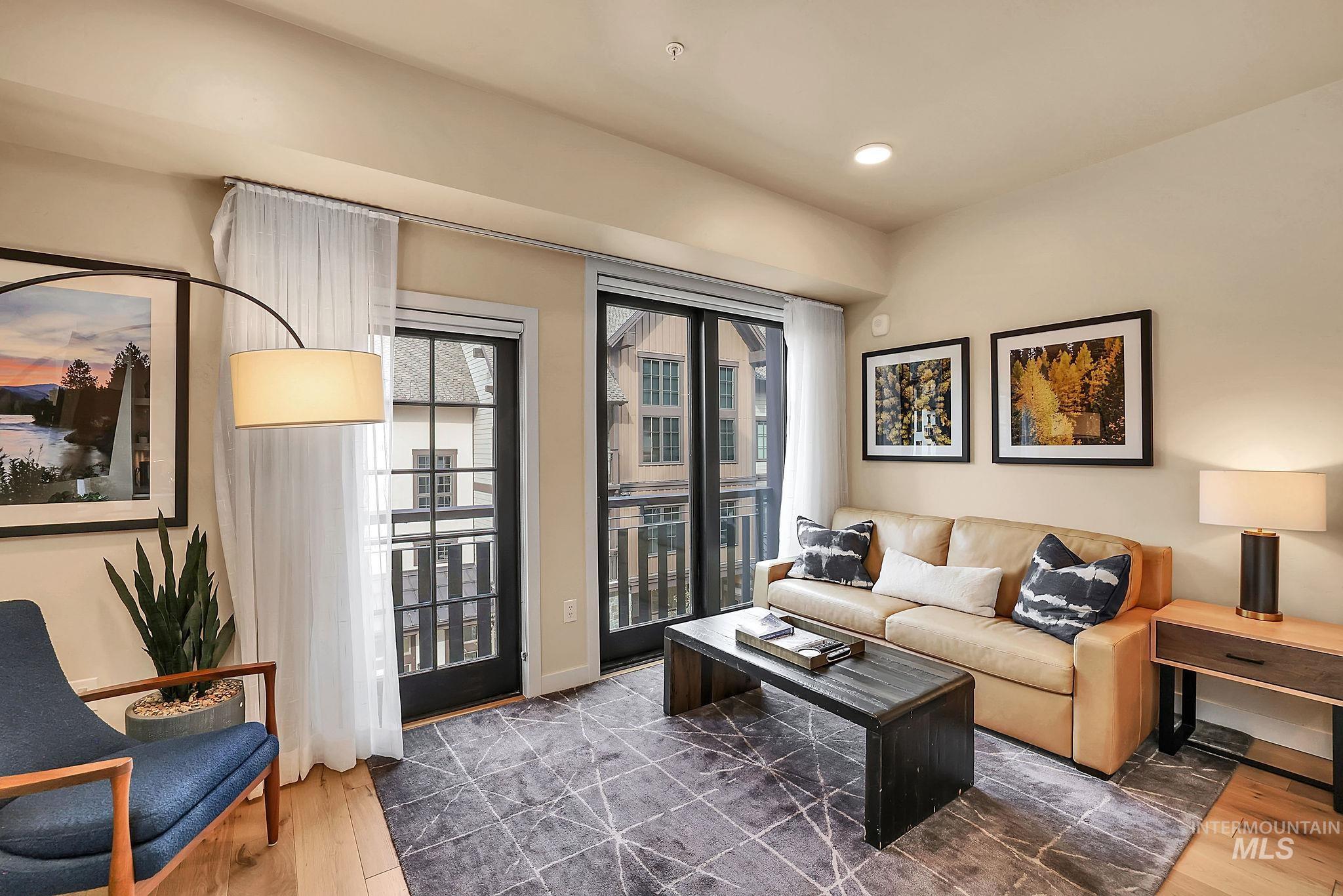 Living room featuring wood finished floors and recessed lighting