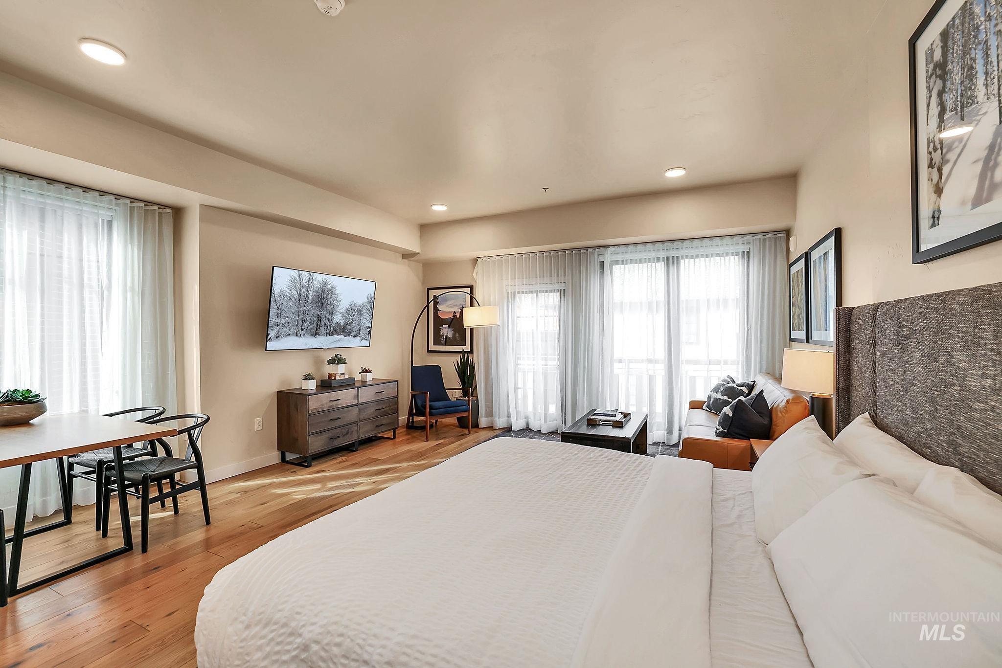 Bedroom featuring light wood-type flooring and recessed lighting