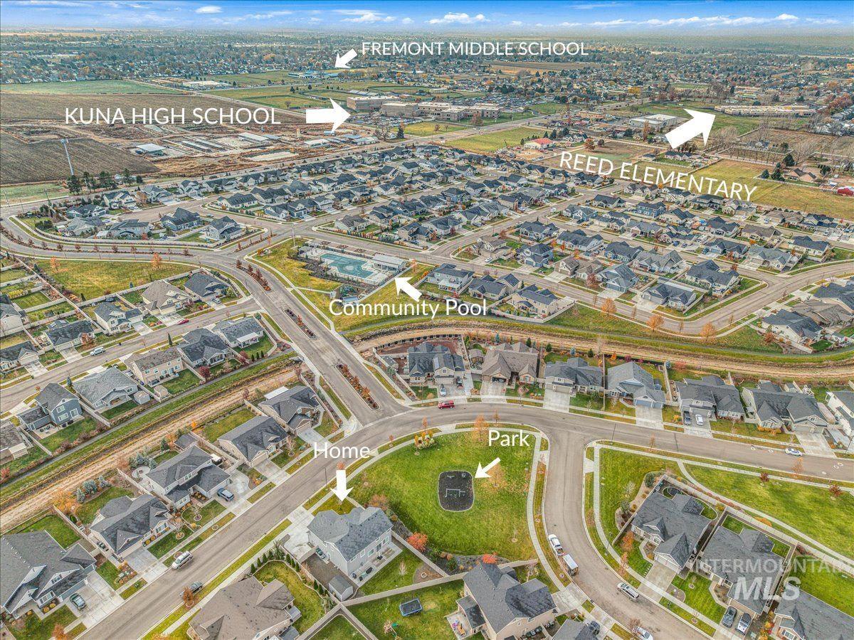 Aerial overview of property's location featuring nearby suburban area