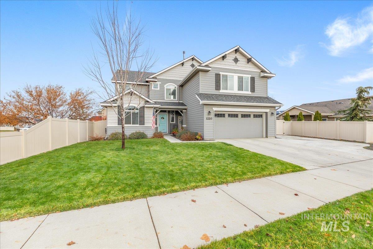 Craftsman-style house with concrete driveway and a garage