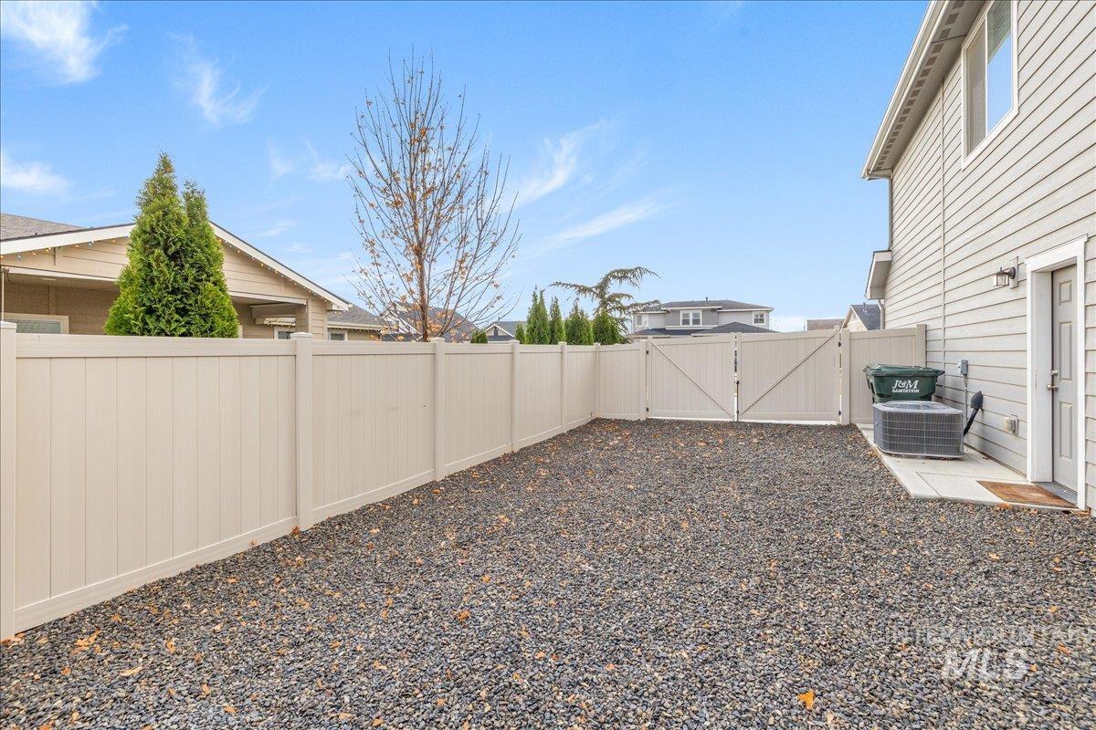 Fenced backyard with a gate