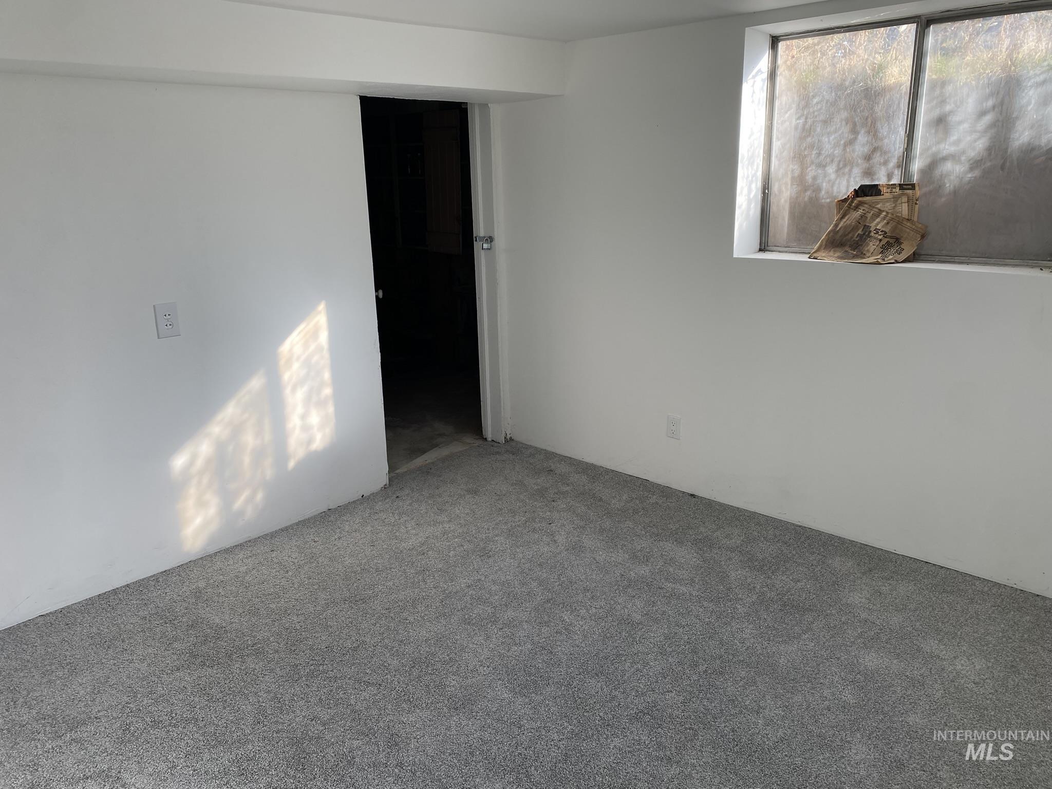 Spare room with carpet floors